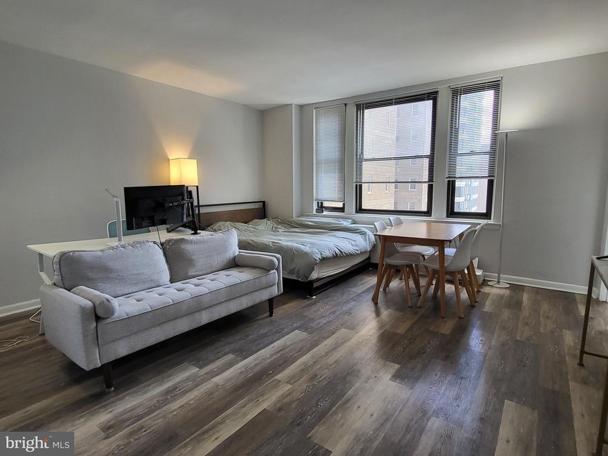 Sun-soaked studio on a high floor of The Wellington on Rittenhouse Square! The unit has been updated to feature brand vinyl floors and fully renovated kitchen and bathroom. The generously sized living area offers excellent natural light and closet space. The separate modern kitchen features sleek white cabinetry, quartz countertop, subway tile backsplash, and stainless steel appliances.  The fully updated bathroom has a modern gray vanity, tub shower, linen closet, and upgraded tile floor. The Wellington is a pre-war apartment building located on Rittenhouse Square offering a 24 hour doorman, on-site management, and access to a nearby fitness center at 1845 Walnut.