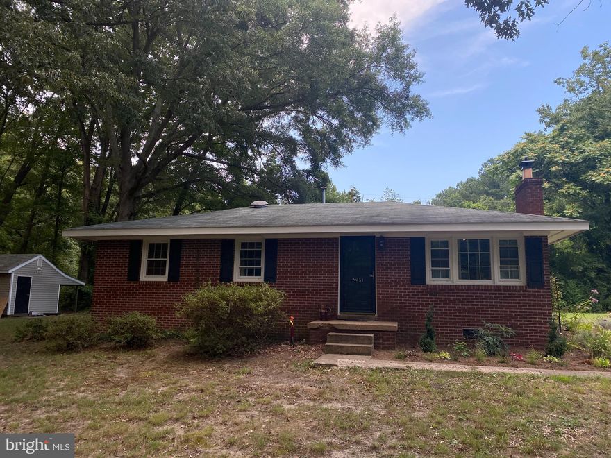 Welcome home to this well maintained 3 bedroom, 1 bath  brick rambler on almost a full acre.  Enjoy the quiet, private surroundings while only a short drive to shopping, medical facilities, entertainment, the VRE & I95.  The living room boasts a magnificent built in entertainment center with integrated wood pellet stove and concealed wiring for all of your electronic devices.   Shed/Workshop with electric. and separate panel box.   In-ground invisible pet containment system.  

Many upgrades to include new Hot water heater 2021, HVAC system  2020, Well pressure tank replaced in 2018, New Septic 2017, Kitchen remodel 2016!  Shed offered As-Is.