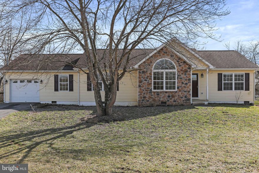 Stunning home with over 5 acres of privacy located near the Opequon Creek in a country setting.  Home boast over 1500 square feet with an oversized one car garage. Features include LVP flooring, granite countertops, sliding barn door entering family room with inviting stone fireplace, separate large living room, stainless steel appliances, deck for entertaining. Floor plan is open and very inviting! Please note bridge over creek is strictly for visual purposes, we do not recommend crossing it.  Contact us today for a viewing!