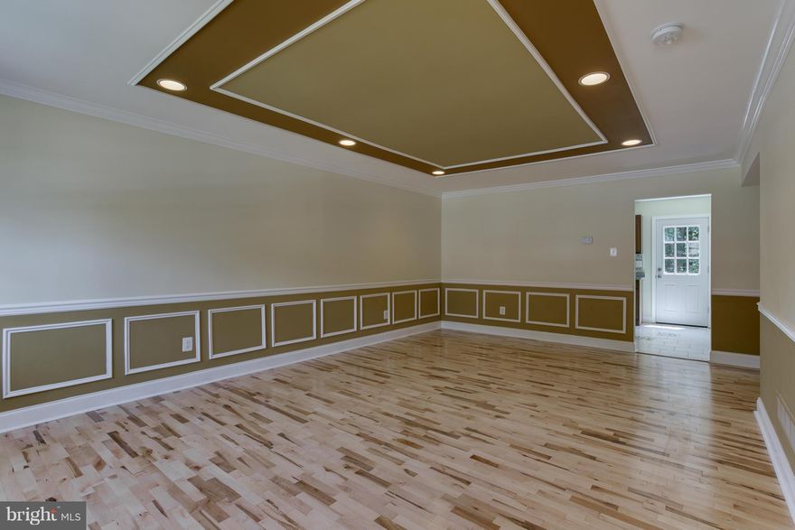 Not a drive by!!  This one is a 10!  Fantastic renovation...updated Kitchen and Bathrooms, beautiful wood floors!  Open Floor plan, this one is priced to sell.  Fully finished basement Walk-Out Rec.Rm.w/ Half Bath. Deck With Beautiful Private Wooded View. Move right into this "just like new" home.