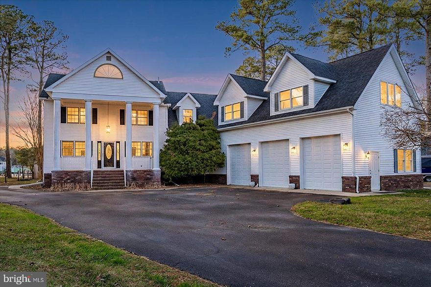 Stunning waterfront estate offering 6 bedrooms and 4.5 baths across three beautifully designed levels. Expanded in 2008, this exceptional home features 5,615 square feet of thoughtfully crafted living space, perfect for entertaining and everyday luxury. Enjoy seamless indoor-outdoor living with expansive water views, a private dock and a boat lift for effortless coastal access. Unwind in the hot tub after a day on the water or at the nearby beach. Additional highlights include a spacious three-car garage, generous living areas, and timeless architectural detail throughout. A rare opportunity to own a premier waterfront retreat just minutes from the beach.