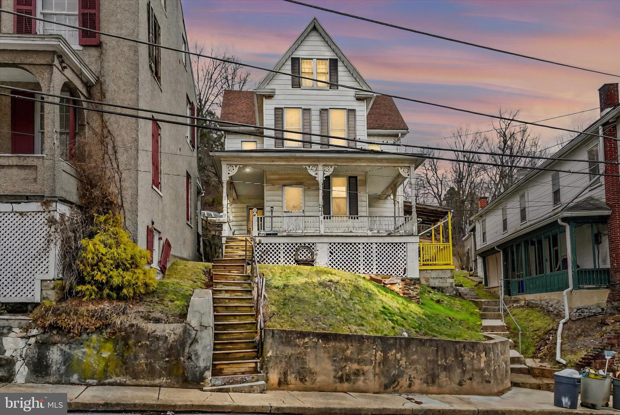 Centrally located in the charming town of Glen Rock, this Colonial offers more than most. The house comes with 3 beds, and 1.5 bathrooms, with the half bath including a shower. There are multiple rooms on the 3rd floor which could be utilized as bedrooms or office/storage space. The additional buildings are located on a separate lot, which allows for added living area or could be converted to a rental. The rear access allows for plenty of parking and the oversized garage, with plenty of room on the 2nd floor is a handymen's dream! Families can be excited to witness the famous Glen Rock Christmas Carolers or sit on the deck at the top of the hill and take in the view!