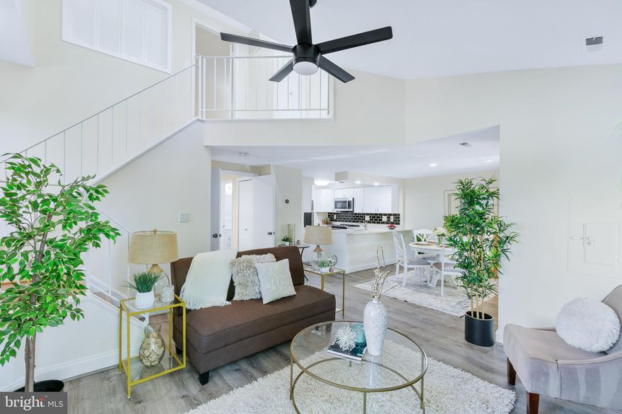 Welcome to this beautifully maintained end unit townhome tucked away into a peaceful corner of the Glenbrook Community of Rogers Forge in East Montgomery Village! The uniquely designed main level offers an open floor plan with great flow through the living room, dining room and kitchen. Vaulted ceilings and an open staircase will catch your eye, giving it a dramatic, contemporary vibe. There are plenty of large windows to provide natural light! You'll also love the wood burning fireplace for cozy winter nights! One bedroom / office a half bath and laundry closet complete the main level. Newer, neutral LVP flooring, brand new carpet and paint throughout make this home the perfect palette for your personal touch! This rare model features two primary suites on the upper level, each with its own private, full bath! A wall of windows along the stairway bring even more character and natural light to this cozy home. Outside, you'll enjoy your private patio space and appreciate the convenience of your very own driveway! Convenient to shopping, restaurants, bus routes and major commuter routes with easy access to many swimming pools, tennis courts, walking trails and park and recreation areas, it's hard to beat this location! Come see what East Montgomery Village has to offer!