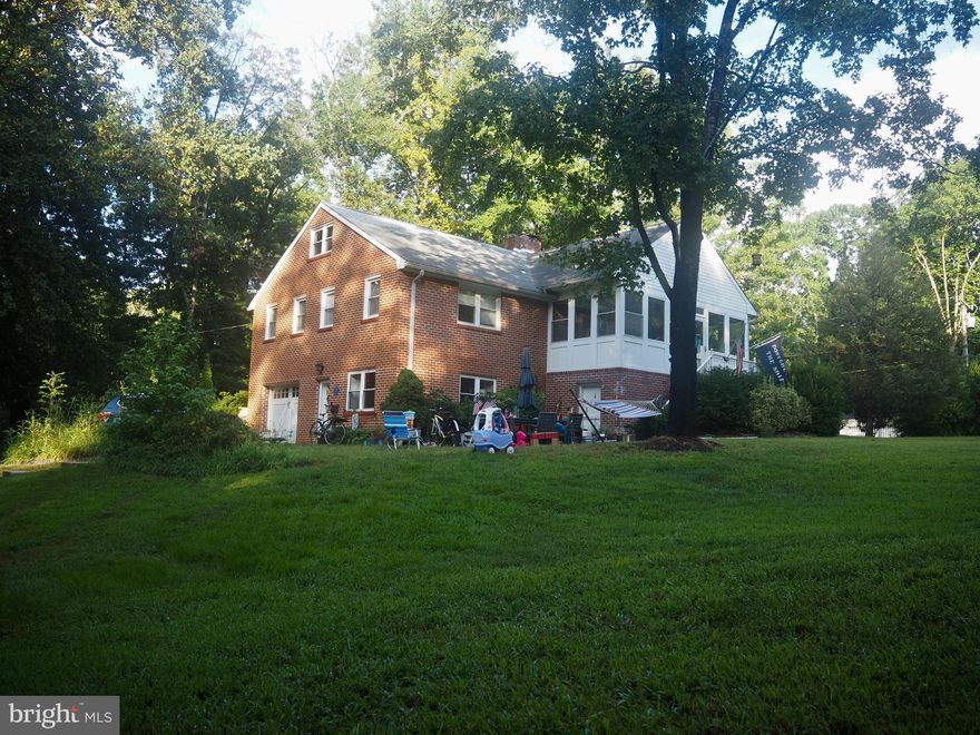 This beautiful and spacious home sits on nearly 1 acre of land. This is a must-have rental property for a big family or those who just love their space! Additionally, it is a water privileged community! This beautiful brick colonial is located minutes away from historic Annapolis. It boasts a large, circular driveway that brings you right up to the gated entrance and the sprawling yard. There is a motorized gate for car access to the attached garage. The main level entrance brings you inside the large country kitchen featuring stainless steel appliances, quartz countertops, gorgeous backsplash, resurfaced cabinets, a brand new Samsung “smart” white glass appliances, with plenty of space for an in-kitchen dining area. Beyond the kitchen is an open space which can be used as a formal dining room, playroom, or other living space, complete with a cozy fireplace with a wood-pellet insert. This continues around to another open room for an additional living/family room, fitness area, or home office. Upstairs you will find another living/family room featuring gorgeous hardwood flooring and a second fireplace. Adjacent, you can enjoy a large, windowed sunroom, ready for all seasons! Take advantage of the 3 spacious bedrooms including the Owner’s Suite with its attached bathroom and walk-in closet. Built-in shelving lines the walls of the Second bedroom. The Third bedroom and upgraded bathroom complete the second level. Continuing to the third level, you’ll enter the Fourth bedroom and another spacious "bonus" room that will fit whatever needs you may have. The large, grassy yard is fully fenced complimented by green trees and bushes. The yard’s appeal is accentuated by a large, in-ground, gunite pool with intricate hardscaping decorating the pool-area as well as a house-adjacent stone paver patio area for lounging outside.  The large yard is perfect for family activities and an amazing area for pets to play all day. Do not worry about upkeep, lawn and pool care are INCLUDED in monthly rent! For all boat and water lovers, the neighborhood provides access to the Severn South River through a neighborhood dock, with a 110’x15’ gravel parkway for RV, boats, etc. The home support systems include a broiler and burner which are rated at 87% efficiency (AFUE), the highest non-condensing oil system you can get. Roof-2010 Gutters & Covers-2014 Heater-2014 Hot Water-2022 Exterior house paint- 2020. Easy commute to Annapolis, Fort Meade, Baltimore and DC. Do not let this opportunity slip by, schedule a showing today!!