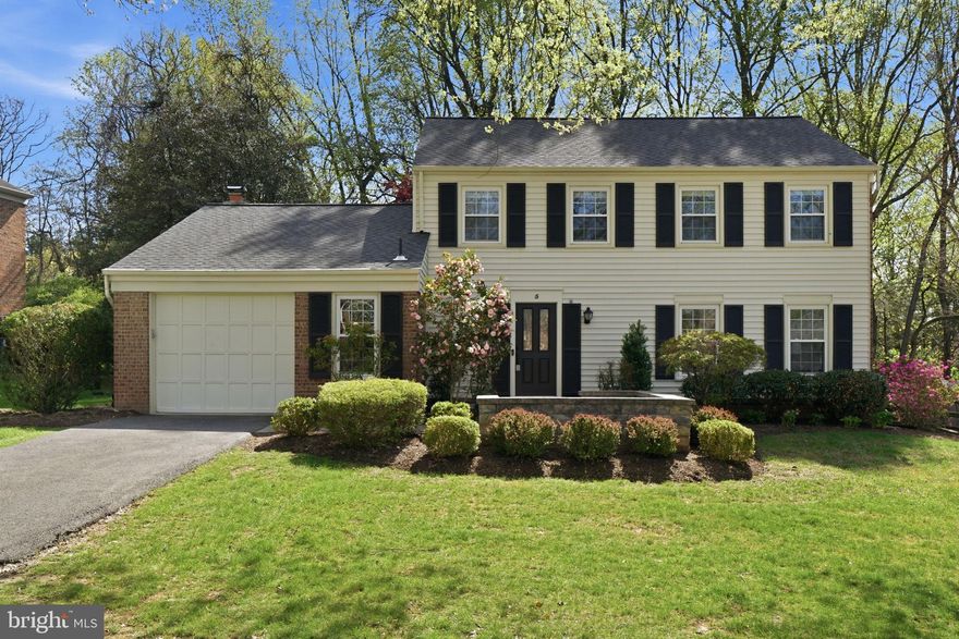 Tucked away on a quiet, tree-lined cul-de-sac in the sought-after Fallsmead neighborhood, 5 Infield Court South offers a timeless blend of classic charm and easy, everyday livability.
A welcoming foyer with tile floors sets the tone, opening to beautifully proportioned living spaces accented by hardwood floors and elegant crown moldings. The formal living room flows effortlessly into a gracious dining room adorned with wainscoting, creating a natural setting for both intimate dinners and larger gatherings. Just beyond, the kitchen serves as the heart of the home—featuring granite countertops, a center island, and a breakfast bar with seating—seamlessly connecting to the adjoining family room, where a wood-burning fireplace and sliding glass doors invite you out to the screened-in porch.
From there, the home extends outdoors to an expansive patio and a fully fenced backyard backing to trees, offering a peaceful, private backdrop for relaxing or entertaining. Access to the one-car garage, and a convenient powder room complete the main level. Upstairs, four well-appointed bedrooms and two full baths provide comfortable accommodations, including a spacious primary suite with a walk-in closet and en-suite bath featuring a walk-in shower. A hall bath with a tub/shower serves the additional bedrooms.
The lower level adds valuable flexibility with an expansive recreation room and ample space for a home gym, playroom, or media area. A full bath completes this level. Fallsmead offers exceptional amenities, including a private 17-acre park with walking trails, a pond, playgrounds, tennis courts, and a neighborhood pool. Known for its tree-lined streets and welcoming, neighborly feel, the community offers an idyllic suburban setting with easy access to major commuter routes, shopping, and dining, as well as highly regarded local schools all within close reach.