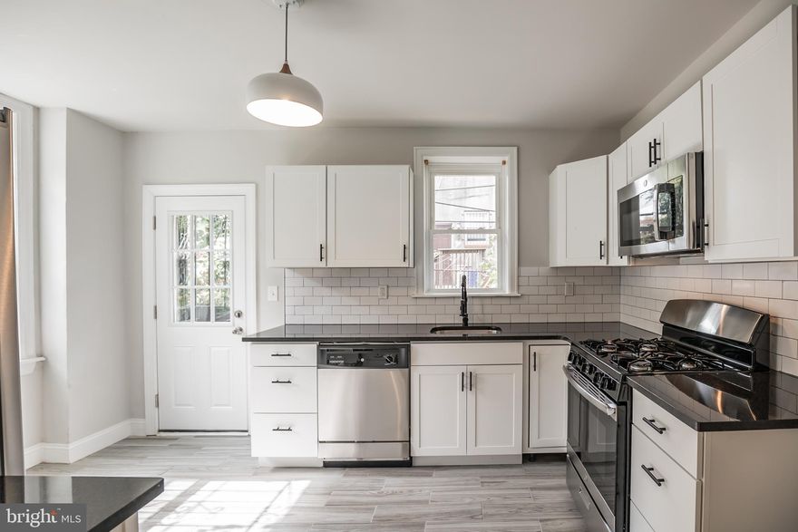 This charming 3-bedroom, 1.5-bath Kingsessing home offers the perfect mix of classic charm and modern updates. Enjoy a recently renovated kitchen, new windows throughout, and beautifully refinished original hardwood floors. The added half bath off the kitchen is so convenient!  A move-in-ready opportunity in West Philadelphia.