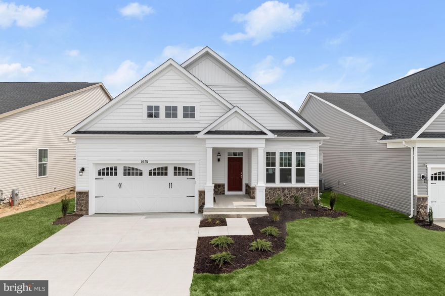 Enjoy the lifestyle you have always dreamed of in this spectacular new home built by Brookfiled Residential in the Riverview neighborhood of the Two Rivers community. The Picasso II model features  exceptional living spaces showcasing soaring high ceilings, a neutral color theme and high-end finishes. A covered front porch greets you as you arrive with accent crown molding and chair railing. Off the foyer, French doors lead to an office that is an ideal space for working in private. The main level highlights an open concept floor plan, making entertaining a breeze. Prepare your favorite meals in the exquisite kitchen that is fully equipped with soft-close 42” cabinets, beautiful quartz counters, pantry, center island with breakfast bar and stainless steel appliances including a wall oven, gas cooktop and range hood. The living and dining rooms have a two-story vaulted ceiling with access to the screened in porch. The main-level primary bedroom suite has two walk-in closets and a luxurious private bathroom with a soaking tub, dual sink vanity, separate water closet and frameless glass-enclosed walk-in shower with a bench. Down the hall are two additional bedrooms, a second full bathroom and laundry closet. Upstairs, the loft provides a great space for additional lounging. The fourth bedroom and a third full bathroom complete this level. Downstairs, the fully-finished lower level includes a massive recreation room that provides a versatile space for all your needs. The fifth bedroom has a walk-in closet and an adjacent full bathroom, making this an ideal space for guests. An expansive storage room and utility room provide endless storage to ensure you stay organized. Featuring luxury vinyl plank flooring, plush carpeting, iron staircase balusters, energy-efficient heating and cooling, sun-drenched windows, an attached two-car garage and thoughtful details throughout.