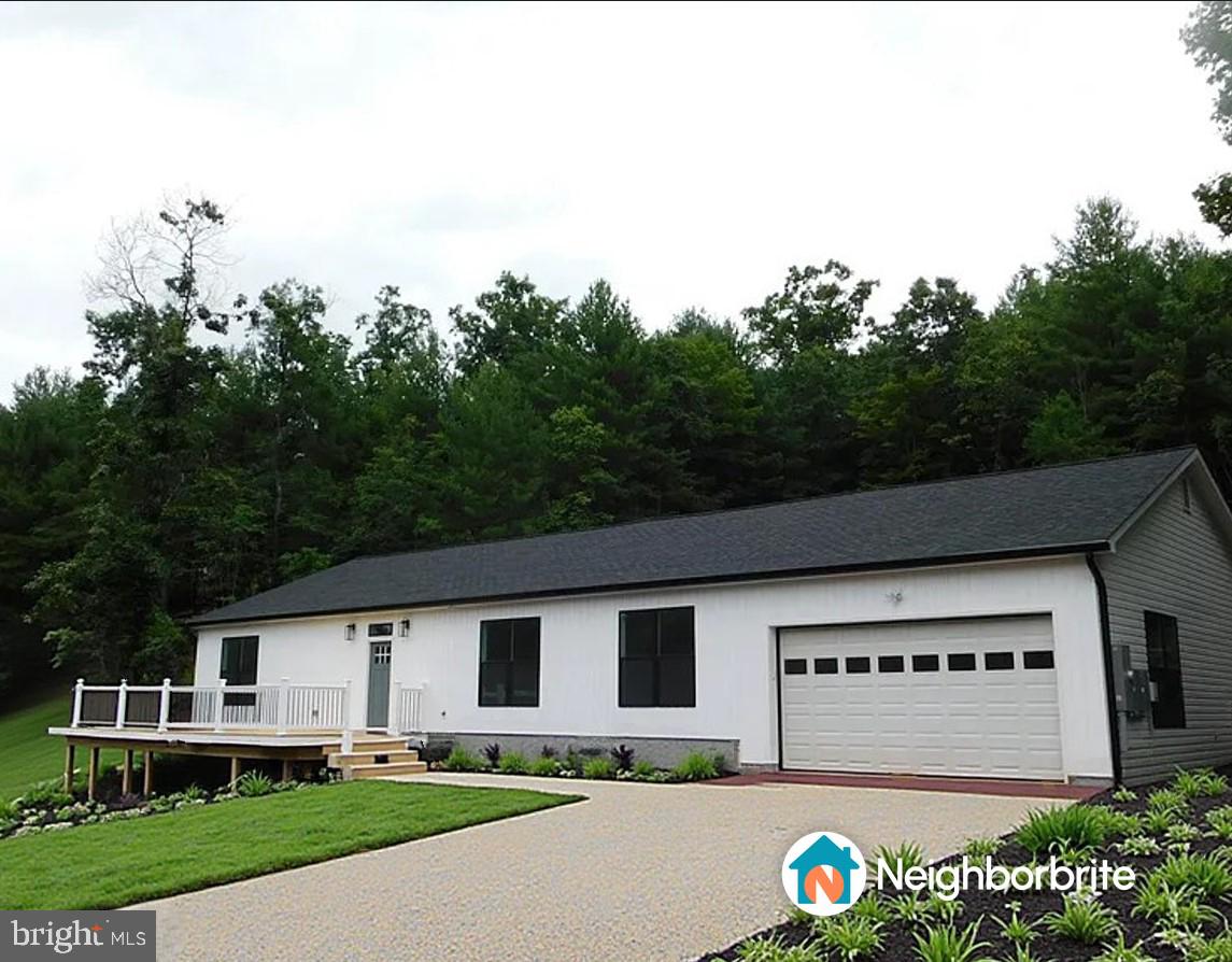 WOW, THIS IS A MUST SEE truly stunning, custom-built rancher that is nearing completion and eagerly awaiting its very first owners. This beautifully crafted 4-bedroom, 2.5-bath home is nestled on a spacious 2.08 acres of unrestricted land, offering complete privacy and the added charm of a serene, year-round stream flowing through the property. With 2,552 sq. ft. of thoughtfully designed living space, this home exemplifies exceptional craftsmanship and elevated style, along with naturally light-filled rooms throughout. The quality construction features durable 2x6 framing and superior insulation for lasting comfort and optimal energy efficiency.
As you step inside, you'll be greeted by a spacious entryway that immediately sets a welcoming tone. The home boasts soaring 9-ft ceilings, 3 foot wide door openings for ease and accessibility, elegant luxury vinyl plank flooring throughout, and beautiful contemporary finishes. The heart of the house is the enormous eat-in kitchen that showcases stylish two-tone white and gray cabinetry, beautiful butcher block countertops, and an oversized walk-in butler's pantry. The generously sized family room seamlessly opens to the back patio, creating a wonderful flow for indoor-outdoor living and entertaining. The primary suite is designed as a true retreat, including a large walk-in closet and a private en-suite bath for your comfort. This home also includes premium features such as a 400 AMP electric service, providing ample power for current and future needs, making it ideal for workshops, EV charging, or any future additions you might envision on the property.
Beyond the home itself, there is an opportunity to expand your investment. To the purchaser of this custom home, the builder is offering the adjacent 7 acre lot at the discounted price of $110,000. This is an opportunity for any buyer that desires enhanced privacy or has dreams of future expansion.
To add more appeal, the builder will provide the buyer a $10,000.00 landscaping credit at closing. Additionally, if the buyer purchases the home using the builder's preferred lender, American Pacific Mortgage, the buyer will receive up to a $10,000.00 lender credit that can be used to buy down their interest rate to help cover closing costs.
Don't miss this incredible opportunity to own a brand-new, custom built home situated in a serene, countryside location just a short drive from I-81. This rare opportunity offers peace of mind with no HOA restrictions and complete privacy. Call today to schedule your private viewing.