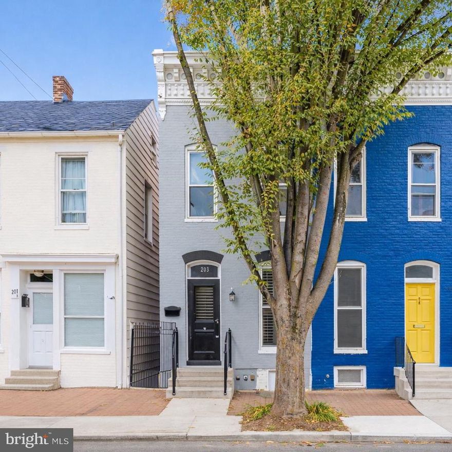 Absolutely outstanding representation of a thoughtfully remodeled rowhome in Downtown Frederick.  There is so much bang for the buck in this property.  Remodeled with the utmost care and consideration, this home has the curb appeal of a classic early 1900's rowhome.  Once entering the home, you are drawn into the wide open living room.  So much larger than it seems, this room can feature your living room furniture as well as your home office/den/table space.  Lots of space to play with here.  You will also notice the recessed lighting throughout, in addition to the huge front window that make this room exceptional for lighting.  The decorative fireplace is an architectural focal point.  But the real gem of the living room is the staircase.  The rebuilt staircase offers considerable width and height.  This gorgeous staircase also allows for ease of moving furniture up and down the stairs.  Something most people don't think about until they go to move in!  Continue on to the formal dining room.  Situated just off the kitchen with a beautiful minimal chandelier, this room is dining table ready.  Enjoy the oversized powder room off of the dining area, perfect for guests.  The remodeled kitchen is an absolute charmer with a combination of open shelving to display some of your most visually appealing serving pieces, and closed cabinets to hide the clutter.  Are you tired of white cabinets in a kitchen?  The granite counters and trending moss green cabinetry are a fresh take.  With room for a small dinette set, the kitchen offers a serene and functional space with ample counter space, stainless steel appliances, and loads of natural light.  Upstairs you will first enter the primary suite.  Separate from the rest of the upper level with a charming half glass door, the primary offers a fully remodeled full bath that gives off major spa vibes.  The primary bedroom offers so much it's incredible.  You have a hall closet for your linens from the bathroom, a full closet with fantastic storage for your clothes and shoes, and the washer/dryer located right in the primary suite for incredible convenience!  You can also access the side balcony from the primary suite for a charming downtown view.  The smaller of the three bedrooms offers a built-in bed that can accommodate a twin XL mattress, or with an additional storage piece (provided), can be a double!  (The mattress on the bed currently is brand new and conveys!)  This room is absolutely charming as a guest room, or conventional bedroom with a fabulous deep closet.  There is plenty of wall space for a dresser or add more built-ins on top of the bed platform for the full office experience.  The third bedroom is street facing and gives you that Downtown Frederick view.  This room is very nicely sized and has a great sized closet.  The closets in this home are fabulous compared to most downtown rowhomes.  Rounding out the upper level is the second full bath with loads of charm.  Clawfoot tub, linen closet and a darling window make this the perfect secondary full bath.  The back yard offers a huge hardscaped patio with raised bed garden area.  The yard is deep and wide with loads of space to play, for pets, or gardening.  There is a shed in the back for storing your outdoor items.  Parking on the street is a breeze and super affordable with a resident's permit obtainable thru The City of Frederick.  There are also garage spaces around the you can rent.  But with this location, you will be walking to everything you want to do!  Come see what prime downtown living looks like.