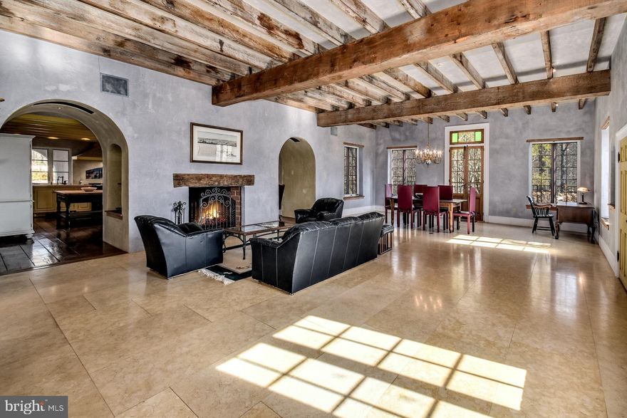 GREAT PRICE REDUCTION....Visit https://bit.ly/2577TownshipRd3D for a 3D walkthrough, and https://www.seetheproperty.com/u/332360 for photos, floorplans & more! Set on three private acres, with views over pristine Cooks Creek, this stunning villa is one of the finestproperties in Bucks County. A rare blend of 19th century touches and outstanding modern luxuries makethis sophisticated home a country retreat you will cherish. European architecture, married to a classic PA environs, produces the desired effect - design and comfort presented artfully and joyfully. A cedarshake roof, textured stucco exterior and antique c.1910 French doors with side gas lamps, provide focalpoints. At every turn, in each carefully conceived room, there is meticulous attention given to the patina of the plastered walls, antique wood flooring and placement of elegant windows, arches, and doorways. The stunning great room has radiant-heated, limestone floors, a grand ceiling height with century old beams, a fireplace with 1820's lintel, antique doors from New Orleans and multiple arched room entries. The kitchen is a cook's dream, equipped with an AGA range, gourmet appliances, limestone counters, farmhouse sink, butcher block prep table, island, bar area, fireplace, and butler's pantry. The luxurious MBR suite is a respite from stress, with a media cabinet, gas fireplace, three balconies, and a jetted tub positioned among windows in an alcove of its own. The master bath has heated floor & steam shower. Two en-suite BRs with balconies complete the 2nd floor, while bedroom, vaulted bonus room, and full bath are on the third. Cooks Creek provides an incomparable backdrop for soothing sights and sounds while adjacent preserved lands ensure that this breathtaking beauty will always remain. Befitting the property's total ambience, a gorgeous pool with hot tub and waterfall is enveloped by a courtyard, overlooking the lush pastureland and neighboring hills and valleys that are the pre-eminent views.