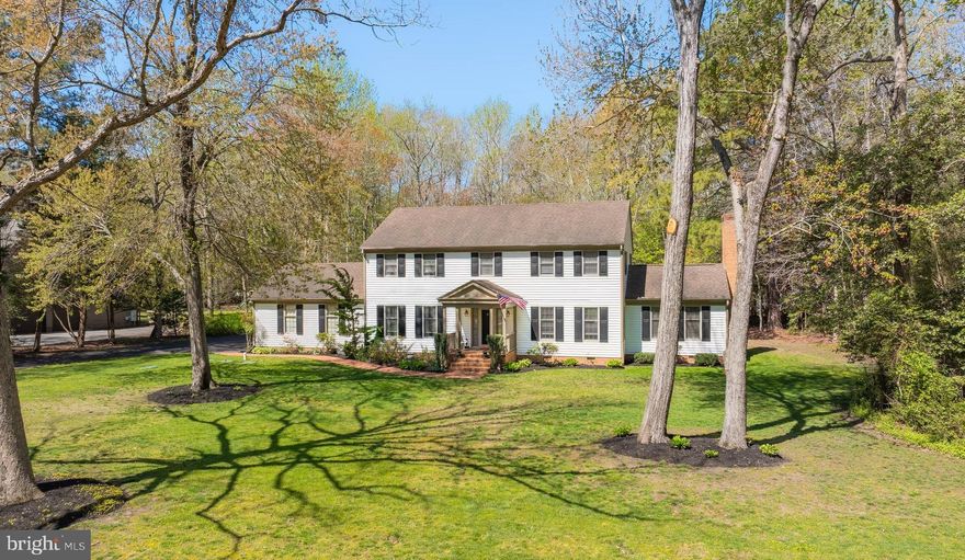 A rare combination of quality, space, and thoughtful upgrades, this immaculate 4-bedroom 3.5 bath Colonial stands out in all the right ways, offering the kind of comfort and setting that makes it easy to settle in and stay awhile. The kitchen has been tastefully updated with quartz countertops and stainless appliances, opening naturally into the main living areas where hardwood flooring runs through portions of the first floor, complemented by wide-plank luxury vinyl and ceramic tile for a finish that feels both durable and refined. Detailed trim work adds character throughout, while the family room serves as a true focal point with a gas fireplace, wrapped wood beams, and a cathedral ceiling that brings both warmth and volume to the space. The layout offers both openness and versatility, featuring separate living and family rooms along with a well-lit home office on the first floor—ideal for remote work or a quiet retreat. An enclosed sun porch extends the home and creates a bright, relaxed space to unwind year-round, while a walk-up attic provides convenient additional storage. The owner’s suite is notably spacious, featuring a large walk-in closet and a well-designed bath with a twin bowl vanity, custom tile shower surround, and glass doors. Out back, the 36x18 saltwater inground pool with a new liner anchors a private setting designed for both everyday enjoyment and entertaining. Recent improvements reflect ongoing care and investment, including updated window balances, a new pool cover and salt cell, new water pump and water softener, a new water heater, and newer refrigerator, microwave, and washing machine, along with a new roof on the sunroom. Homes with this level of care, space, and outdoor appeal don’t come along often—this is one you’ll want to experience in person.