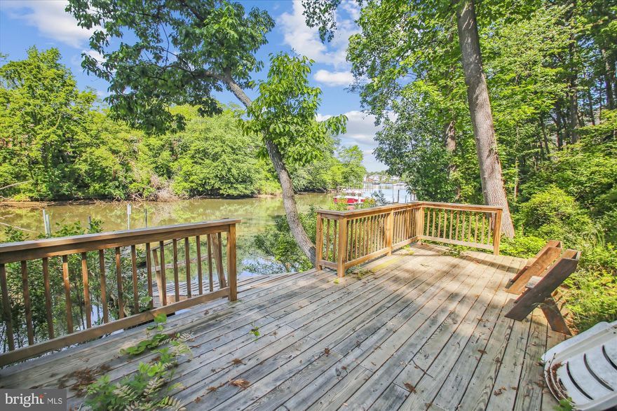 Rarely available Eastport townhome offering direct water views and access to Spa Creek in a private, waterfront-style enclave on serene Hawkins Cove.  Enjoy the Annapolis waterfront lifestyle without the waterfront taxes—this beautifully maintained home features over 2,000 sq. ft. of light-filled living space and three expansive balconies overlooking the waterfront.  Perfect for kayakers or paddleboarders, the property is just steps from the private community dock and water access point.  Inside, the sun-drenched primary suite feels like a sanctuary with vaulted ceilings, a cozy fireplace, and spa-inspired bath. Multiple stacked stone fireplaces add warmth and elegance throughout. Whether you're enjoying sunrise coffee overlooking the water or taking a water taxi to nearby restaurants and marinas, this home delivers the ultimate Eastport experience.  Located in a quiet, hidden waterfront community with easy access to downtown Annapolis, this is a rare opportunity to live on the water’s edge—ideal as a year-round residence or lock-and-leave retreat.