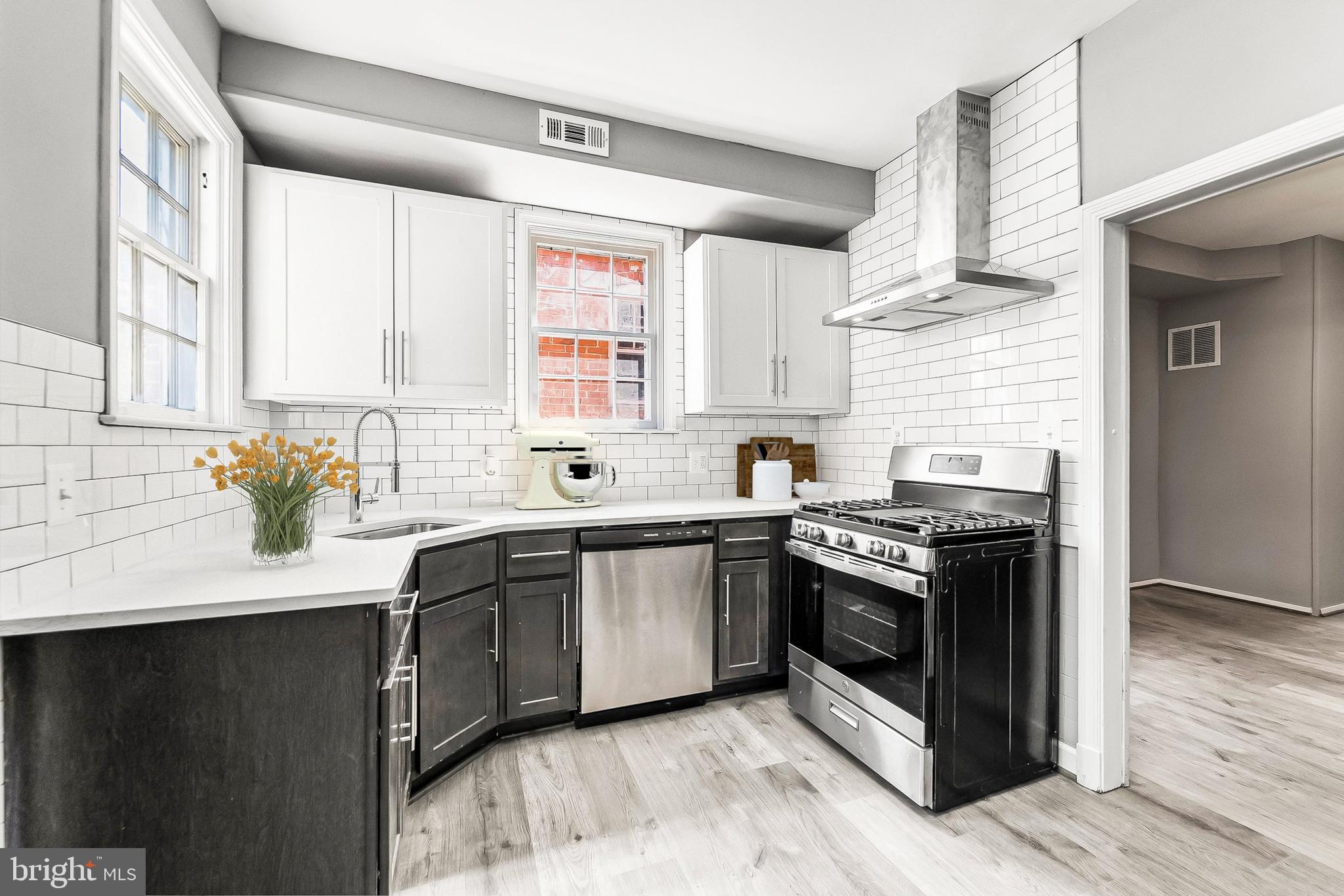 Priced To Sell Fast! Hot Updated 3 Level Solid Brick Rowhouse, Spacious Kitchen with QUARTZ Counters, Stainless Steel Appliances, Modern Tile Backsplash, New Cabinets, Spacious Bedrooms, New Custom Paint, Updated Bathrooms, New Flooring, New Lighting, Brand New HVAC, Much More!! Close to Schools, Shopping, and Commuter Routes. This Will Not Last!