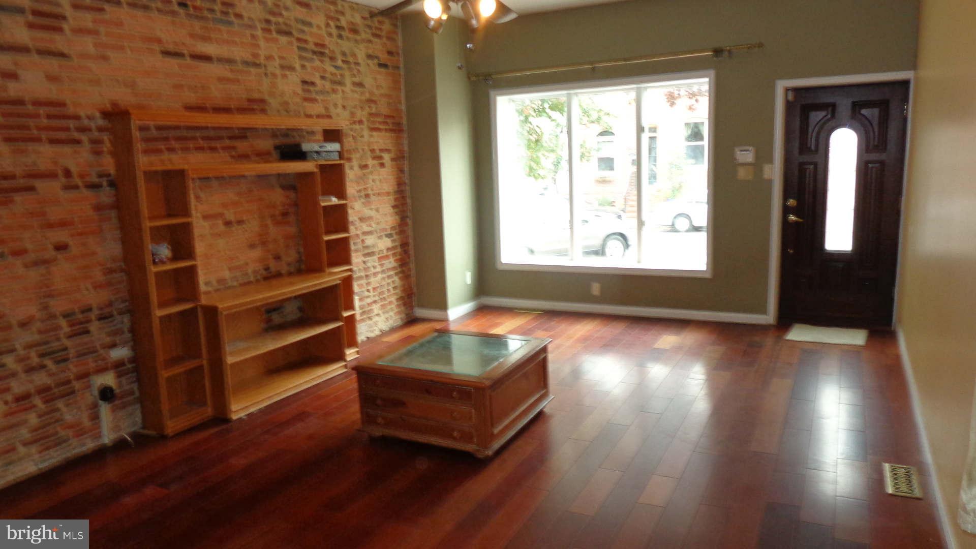 TRULY UNIQUE, and rare End Unit in Locust Point. Brazilian Cherry floors and exposed brick throughout, give this home that sophisticated feel with the rustic charm that is the essence what you seek. Great space for both living and entertaining, relax in your 2 person soaking tub at the end of the day or sun yourself on the deck overlooking the harbor. Det fin garage for studio/office,A MUST SEE!