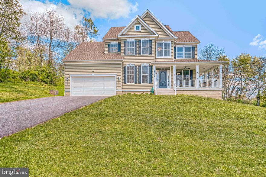Welcome to this beautifully upgraded custom colonial! Filled with natural light and thoughtfully designed living spaces, this home offers the perfect blend of elegance, comfort, and functionality. The inviting front porch leads into an open-concept layout featuring a private home office, formal dining area with tray ceilings, and spacious living areas ideal for entertaining. The gourmet kitchen is a standout with 42” white shaker cabinetry, granite countertops, stainless steel appliances, a large center island, and sunny breakfast area overlooking the backyard. The dramatic family room features soaring cathedral ceilings and a stunning stone fireplace. Upstairs, the luxurious owner’s suite offers a spacious walk-in closet, spa-inspired bath with designer tile finishes. Three additional generously sized bedrooms, and full bath complete the upper level. The walk-out basement is partially finished and has bathroom rough-ins, providing endless possibilities for future expansion and added value. Situated on a peaceful private lot, this move-in ready home offers the space, upgrades, and layout today’s buyers are searching for!