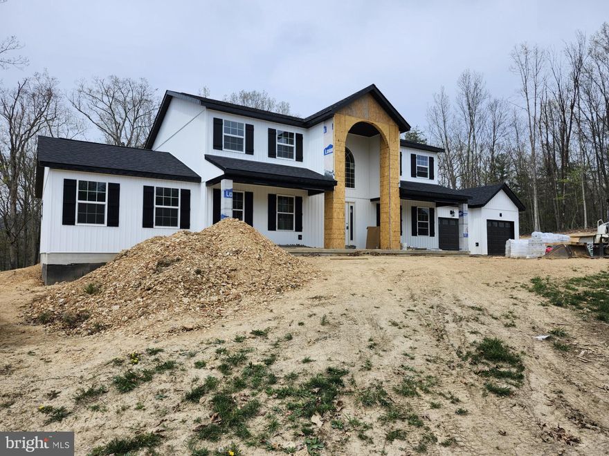 WELCOME TO LAKEWOOD! This Contemporary Modern Style Farm House is 3,796 SQ FT under roof, 2800 SQ FT of living space, which includes a heated and insulated 600 SQ FT two car garage, and front/rear  covered porch area's. This home is built by "PATTERSON CREEK ENTERPRISE LLC", offering a unique design, a beautiful archway sitting over the main  entrance, and an open and spacious floor plan. This home offers an abundance of living space, which includes 5 Bedrooms, 3 Full Bath's, 2 Living rooms, 2 Laundry rooms, Kitchen, and a huge Dining room! The main floor will have 3/4 inch gray-stained hickory hardwood floors throughout excl. one bedroom, the bedroom and the upstairs rooms will be carpet.  This home has 2 heat pump's, and is supplied with 400 amp underground electrical service. The exterior of this home offer's a combination of Charm and Sophistication, it is a white  vertical vinyl siding board and batten  style, with black shutters, the pillars and archway on the front of the house will be a black brick finish, and black seamless gutter's and downspout's. Upon completion of this home there will be a gravel driveway, and the yard will have grass seed and straw put down. This home offers an abundance of closet space, throughout the entire home. The living room on the upper level could be used as a home office, or a workout room, whatever your heart desires. This is a METICULOUSLY well crafted, Custom built home, in a premier private lake community with miles of shoreline, playgrounds, trails, beach area, with a pavilion and restrooms. I HAVE INCLUDED THE FLOOR PLAN AND DIMENSIONS, AND THE SPEC SHEET OF ALL CONSTRUCTION AND FINISH MATERIAL'S USED. HOME SHOULD BE FINALIZED IN 6-8 WEEKS.