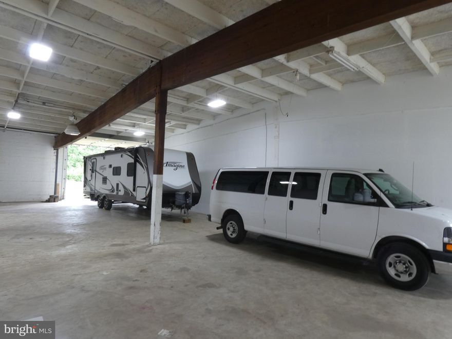 2880 sq. ft. Commercial warehouse drive thru space, Two 12'x12' overhead doors, one in the front of the warehouse, and one in the rear, separate 200 amp service, ceiling mount propane furnace, tenant pays electric & propane