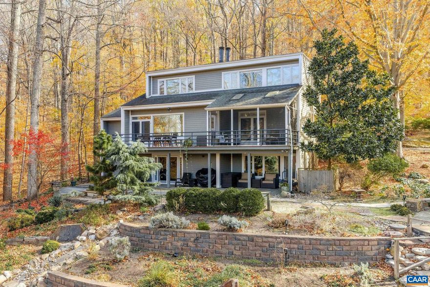 A rare gem designed by renowned UVA architectural professor Jim Tuley, this striking contemporary home sits atop 30+ private acres with sweeping Blue Ridge Mountain views. Walls of glass fill the home with natural light and frame the stunning landscape. Highlights include a remodeled kitchen, newly updated bathrooms, and a primary suite with a soaking tub overlooking the mountains. The property features beautiful gardens, mature plantings, fruit trees, a koi pond, stunning stonescape and a versatile barn/art studio ideal for creative or functional use. With solar power, a newer whole-house generator, and division potential, this private retreat combines architectural sophistication, sustainability, and investment opportunity?just minutes from Charlottesville.,Soapstone Counter,Wood Cabinets,Fireplace in Home Office,Fireplace in Living Room