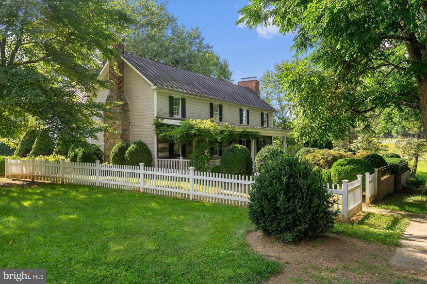 Welcome to "Dobbins Creek Farm" (circa 1734). With 2 streams, 3 outbuildings (huge Dairy barn, stone spring house and Corn crib) this 11 acre property is a rare find. Historic and modern - it's blended seamlessly into a "new" old house. Heart of pine floors, 3 working fireplaces, a Wisteria framed brick front porch, picket fences, Boxwoods,  and meandering paths through time itself. Stand amazed!