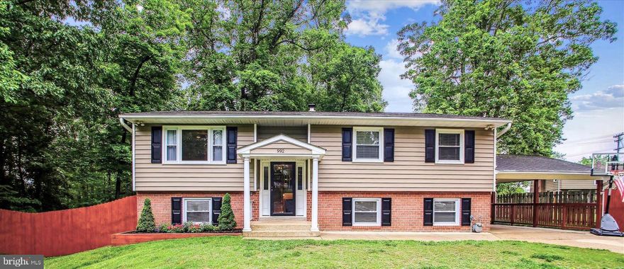 Welcome to your move in ready 3 bedroom 3 bath Split Foyer in the sought after Campus Green Community,  Entering the main level of the split foyer you will enter through a new Pella Front Door, and as you walk upstairs, you are greeted by 3 main rooms, the living room, dining room and kitchen.  
A wooded floor hallway will lead you to the newly updated main bathroom with tub and shower. As you proceed onto the  primary suite, there is a newly updated primary bathroom with shower.  Proceeding on, you will find the two additional bedrooms.  All bedrooms have ceiling fans. Entering the cheerful kitchen,  you are greeted by a light filled recessed window for your herb garden, recessed lights, pendant lighting, stainless steel appliances, ceramic tile floor, and granite on both counters and island.  The island comfortably seats two for a casual breakfast and lunch. Entering the Living Room you  will find a large picture window which looks out onto the cul-de-sac, with hardwood floors, crown molding, recessed lights, and a ceiling fan for your entertainment pleasure. 
Entering the Dining Room, you will enjoy the new Pella sliding doors that lead to the large outside deck and large screened porch to extend your entertaining, savor summer breezes and moonlit nights. 
The dining room has recessed lighting, crown molding and chair railing.  The flooring in the dining room is ceramic tile. Descend to the lower level, where  two versatile flex rooms await.  Perfect for use as a home office, playrooms to suit your family needs.   The owners use the first flex room on the left as a family room and exercise room that has been updated with Pergo defense waterproof laminate flooring, and recessed lighting. The family room has a new Pella sliding door that leads out to the lower level large patio.  
The downstairs hallway also has been updated with the Pergo defense waterproof laminate flooring.  The second lower level flex room is currently being used as the owners bedroom, and has new carpet, installed April 2024, and  is graced with a wall of closets, two windows, and on the other wall are built in bookshelves.  A hallway leads you to the third bathroom -recently updated with a new vanity, shower unit, and new lit mirror.  The laundry room on the lower level is unfinished with the washer and dryer, HVAC, water heater, and room for ample storage.  A door in the laundry room leads you out to the lower large outside patio.  The driveway has a carport for one car, and four additional cars on the driveway, in addition to street parking.   The owners added a nice private front fence, and a fence at the carport.  The front and backyard were seeded in Spring 2024.  The large deck on the back overlooks a wooded backyard.  Come to see this well-maintained home with neutral decor, in a sought after neighborhood. 
Schedule your tour today and experience the comfort and charm this home has to offer!