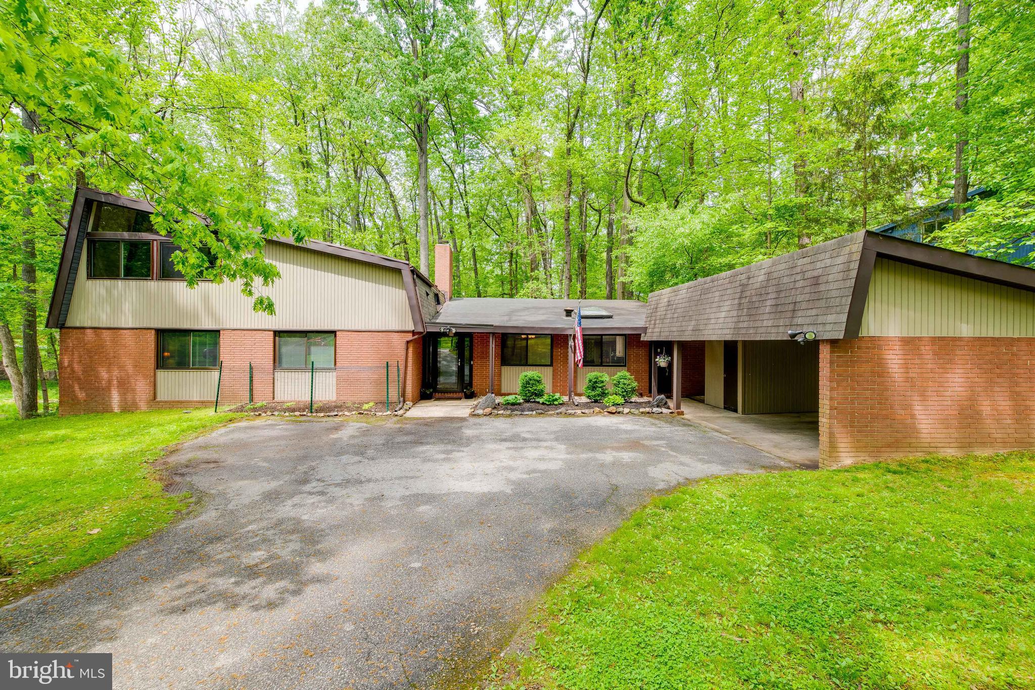 Mid-Century Modern with modernization. This Gordon Sugar Custom 5 bedroom, 3 full bathroom home has the best of both worlds... secluded backyard, home to incredible wildlife, yet seconds outside the Beltway for easy commuting. Wide open floorplan with exposed beams and vaulted ceilings. Main floor includes huge living area, eat-in kitchen and separate dining room, as well as 3 bedrooms and 2 full baths. Upper level has 2 more bedrooms, a full bath, spacious second living area and 2 large storage spaces. Private patio and fenced in backyard. Recent updates include HVAC, Hot Water Heater, Replacement Windows and Flooring. Enjoy this picturesque wooded neighborhood while being close to urban conveniences, retail and entertainment.