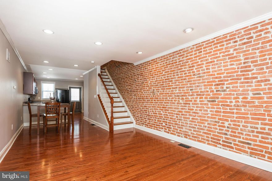 Wonderfully appointed 2 bed 2 bath home in close proximity to Patterson Park and Arts District.  Large eat in kitchen, hardwood floors throughout, PARKING PAD, recessed lighting, exposed brick, separate tub and shower, finished basement, recent neutral paint throughout.