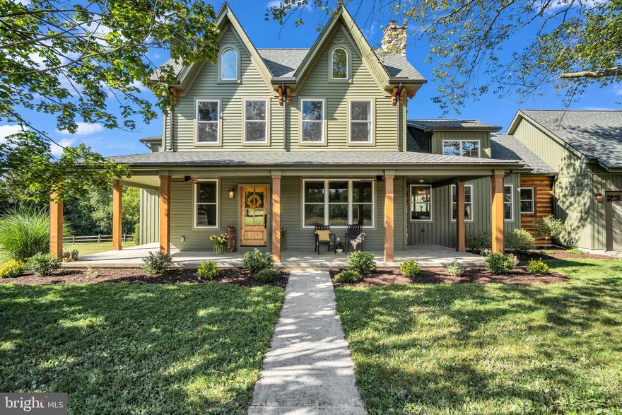 Tucked away on 7.87 lush, picturesque acres bordered by the serene Yellow Breeches Creek, this fully renovated estate is a rare find—offering timeless beauty, state-of-the-art amenities, and room to live, work, and play in harmony with nature.

Step into the heart of the main home and be transported to the English countryside, with spacious living, built in cabinetry and a Pinterest worthy powder room. But it's the one of a kind kitchen that is a culinary showpiece featuring ZLINE appliances, including a 7-burner, double oven, gas stove, all set against a warm terra cotta tile backsplash. Quartz countertops and a reclaimed live edge white oak chef’s island offer both elegance and functionality, while a walk-in pantry provides ample storage. The cobblestone chimney wall serves as a striking focal point, adding old-world character to this thoroughly modern kitchen.

The first-floor primary suite is a private sanctuary featuring a spa-inspired bath with additional plumbing ready for a freestanding tub, laundry area, walk-in closet, and a charming sitting room ideal for reading, relaxing, or working from home.

Upstairs, a sunlit stairwell sitting area leads to four spacious bedrooms, including a second primary suite with a full bath and walk-in closet. A full bath, second-floor laundry, and two finished attic spaces add convenience and versatility, perfect for a home office, studio, or playroom.

But the luxury doesn’t stop there.

Back on the main level you will find additional living space, ideal for guests, in-laws or just a separate area to call your own. This area includes a full galley kitchen with leathered granite countertops, living space, full bedroom with en-suite bath, laundry, walk-in closet, and an outdoor covered sitting area—offering privacy and comfort with all the amenities of a home.

As you tour this designer home, be sure to take the time and appreciate the special finishes such as the welly boot rack in the mudroom, the extra large trim throughout the home, antique-inspired doorknobs, push button light switches, built in cabinetry, arched doorways, finished attic areas, and so much more.

Outside, enjoy panoramic views of South Mountain, open skies, and fly fishing on the world-renowned Yellow Breeches Creek. This peaceful setting is a haven for nature lovers, with opportunities for kayaking, swimming, birdwatching, or simply unwinding in your own slice of paradise.

Two massive outbuildings open the door to endless potential—convert to a barn for animals (as permitted by zoning), create hobby workshops, establish a home-based business, or build out the ultimate storage or entertainment space.

Whether you're looking for multigenerational living, space for creative endeavors, or a tranquil retreat with incredible character—this one-of-a-kind property delivers.