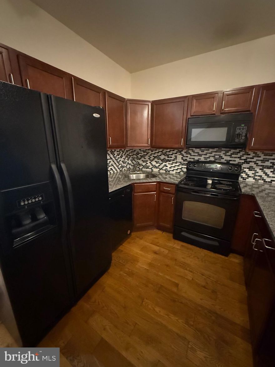 This expansive two-story, second-floor apartment offers five spacious bedrooms and five full bathrooms, providing the perfect setup for large families, roommates, or anyone who values space and privacy,this all-electric unit features beautiful hardwood floors throughout and central air conditioning for year-round comfort.

The modern kitchen is fully equipped with a refrigerator, stove, microwave, and there’s also a washer and dryer included in-unit for added convenience. Small pets are welcome with a one-time $250 pet deposit. A $30 monthly water fee applies per adult occupant, and tenants are responsible for electricity.

Private parking is available for an additional $125 per month. With generous living space, modern appliances, and a well-maintained layout, this apartment offers both comfort and convenience in one of the most desirable setups around.