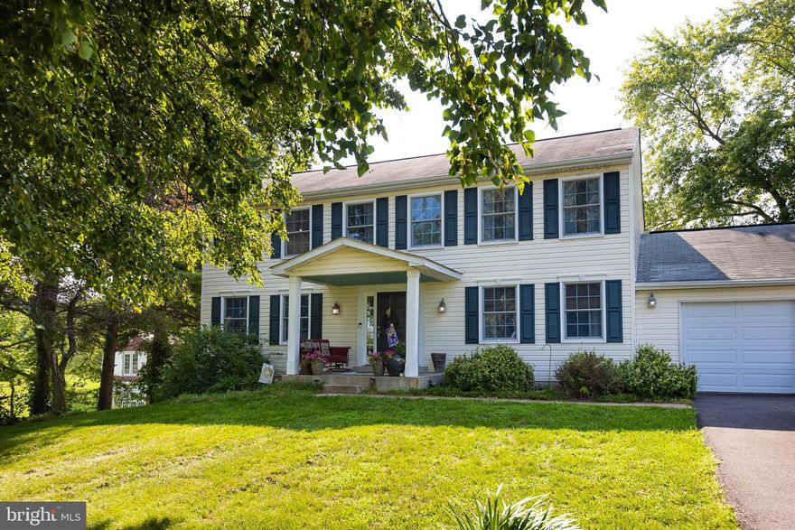 This is THE ONE you’ve been waiting for! This stunning colonial features 3400 square feet of updated and beautifully maintained living space, a 2-car attached garage and a tremendously versatile 2000 sq. ft barn w/electric. Step in from the front porch and be welcomed into a spacious foyer with custom wainscoting and a main level that boasts warm hardwood floors throughout. The floorplan features a formal LR and DR, generously sized, along with an open kitchen and FR. The kitchen boasts granite countertops (2019), tile backsplash (2019), stainless appliances including a French Door style refrigerator (2019) double wall oven, built in microwave and a walk-in pantry with vintage glass paned door and custom shelving and storage. A powder bathroom and mudroom area round out the kitchen space. The adjoining FR features gorgeous views of the backyard and a wood burning fireplace. Step out onto your extra-large TREX deck with new steps (2024) and lattice surround (2024) and survey your personal oasis 7 minutes from downtown Frederick. This home has a 3.24-acre lot complete with above ground swimming pool (new liner 2020, new pump 2023), basketball/sport court, partial fenced area (2023), room to roam on ATV’s and a 2-story, 2000 square foot barn with electric and a metal roof. Head back inside and upstairs to find 5 generously sized bedrooms, including a primary with ensuite bath and walk in closet. The secondary bedrooms share a hall bath with double sink and large linen closet. Laundry is also located on this level for your convenience. This home features a fully finished walkout basement with a bedroom area, living/dining space, kitchenette (2022), full bath (2022), and an office/storage space. With a separate entrance this space is perfect for additional living space. Additional updates include a recently expanded and paved driveway (2023), custom wainscoting and beadboard trim throughout (2019), chimney cleaned and inspected (2022), and some updated flooring (2024). This unique property is perfectly situated 1 mile from Rt. 15/340, and just 7 minutes from downtown, yet feels a world away from it all. NO HOA or city taxes!! Come enjoy the peace & serenity this home offers, the stunning sunsets and built in activities, yet remain close to schools, shopping and all that Frederick has to offer! Professional photos to come by Aug. 16.