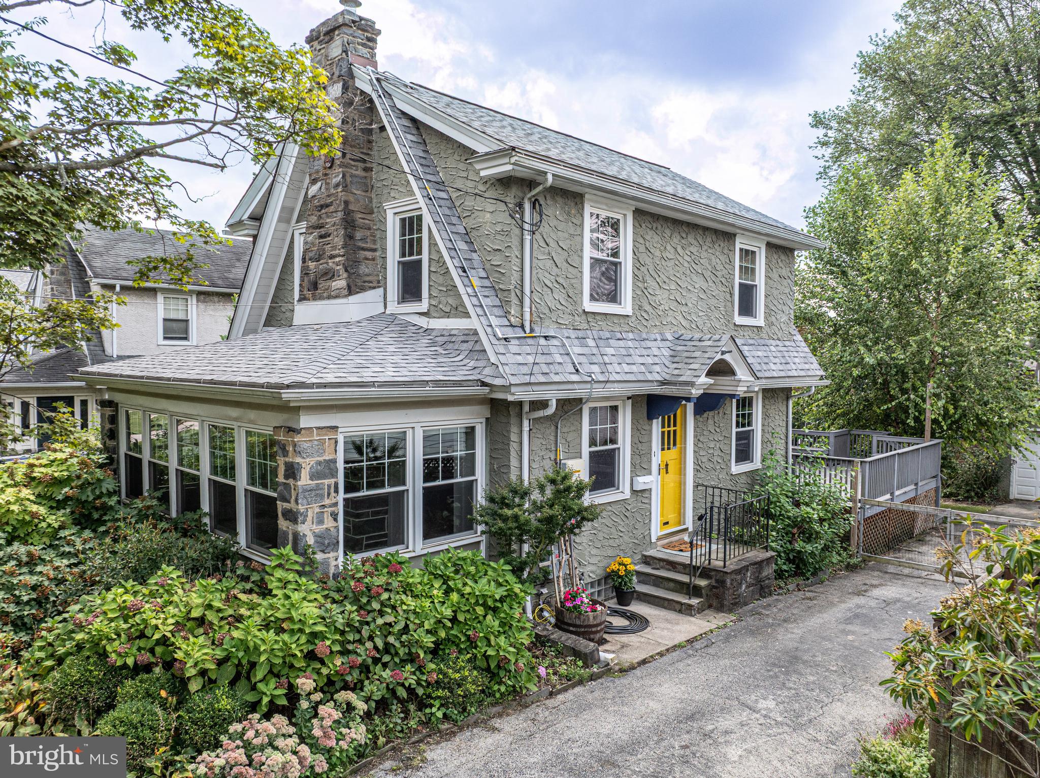 Offering the perfect blend of neighborhood charm and Main Line convenience, this 1945 Dutch Colonial sits on a quieter stretch of County Line Road in the close-knit community of Ardmore.
Here, daily life feels a little easier. Stroll to South Ardmore Park for summer picnics or soccer games, pick up dinner at Carlino’s Market, or catch a train nearby on Amtrak/SEPTA or the Norristown High Speed Line. Schools, coffee shops, restaurants, and mom-and-pop stores are all within walking distance, while Trader Joe’s, Whole Foods, Suburban Square, Haverford YMCA, Merion Golf Club, and Kaiserman JCC are a quick drive away.
The home is warm and welcoming, with classic Main Line curb appeal and mature, pollinator-friendly landscaping. A newer roof (2021), gated driveway, and fully-fenced yard offer peace of mind, while the spacious back deck is perfect for weekend barbecues, birthday parties, or coffee with a good book. Inside, you’ll find central AC, a cozy gas fireplace in the living room, and freshly refinished hardwood floors throughout. The large, updated kitchen is ideal for anyone who loves to cook, with stainless steel appliances and easy access to the back deck for dining and entertaining outdoors. Upstairs, the hall bath pairs modern finishes with vintage tile for just the right touch of charm. A bright sunroom and a partially finished basement, with a second full bath and laundry room, provide flexibility for a home office, playroom, or guest suite. The detached garage offers storage for everything from bikes to lawn equipment to seasonal decor.
As an added bonus, the sellers will pay off the solar panels at closing. Currently covering about one-third of the electric bill, the solar panels provide immediate savings to the lucky buyer.
Schedule your showing today, and come see why Ardmore is consistently ranked as one of Pennsylvania's best places to live! Showings begin Thursday, Sept. 11th. Open houses Thursday, 12-2 pm and Saturday, 1-3 pm. Note: some photos are virtually staged.