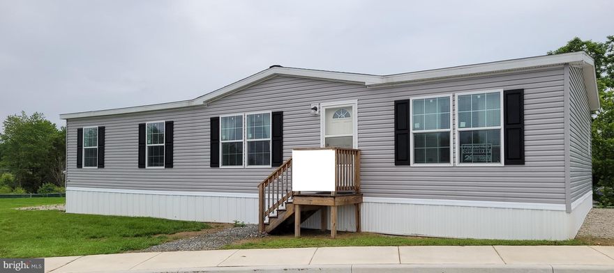 Brand New - 2024 Eagle River Model - Stunning, spacious, brand new 28 x 56 doublewide 3/2 home with living room, separate family room, beautiful open kitchen, & dining room. This home is immaculate with all modern upgrades, large bedrooms, walk in closet in primary, recessed lighting, vinyl & soft carpet flooring. Complete appliance package includes dishwasher, stove/oven, refrigerator, microwave and full size washer & dryer. Large pantry offers great storage. Lot Rent is $873 a month.  Brand New A/C, brand new water heater.  Gas heat & stove.  Manufacturer's warranty covers all items!