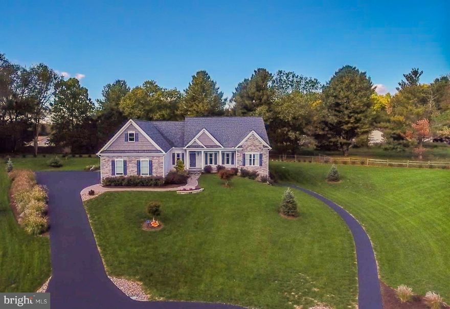 11/14/19 - NEW IMPROVED PRICE! Extremely well-maintained and beautifully situated rancher on a .95 acre which features an open split-bedroom floor plan, a full walkout basement, and a seasonal screened porch to bring the outside in.  With a perfectly manicured lawn and incredible landscaping, paved drive and stamped concrete sidewalks - you'll want to spend more time outdoors.  The property has an immediate curb appeal with the exterior stone and vinyl, modern finishes, and clean lines.  Perched on a hilltop with beautiful views looking out, this one owner, custom built home is immaculate and located in a small community just outside Historic Shepherdstown.