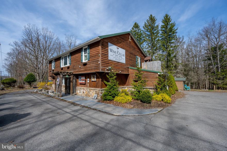 Here is your opportunity to own an awesome commercial location at Deep Creek Lake. Currently being operated as WIne Cellar at Deep Creek. Property is located in residential zoning but has a special exception to run the retail business. Please see email from Planning and Zoning about continued commercial use and also Garrett County Liquor Control Board email regarding liquor license. Large 2BR/2BA apartment on the second level so you could run the business and have a place to live also. Massive stone fireplace on the lower level, commercial kitchen including walk in cooler, Men's and Women's restrooms. Plenty of space for restaurant, retail, etc. Owner would consider selling the business and inventory as they are negotiable. Well is shared with neighboring property. RAILEY REALTY IS NOT THE CARETAKER OF PROPERTIES LISTED BY IT. DURING INCLEMENT WEATHER CONDITIONS, PROSPECTIVE PURCHASERS AND THEIR AGENTS ASSUME ALL LIABILITY ASSOCIATED WITH OR BY WEATHER AT THE PROPERTY.