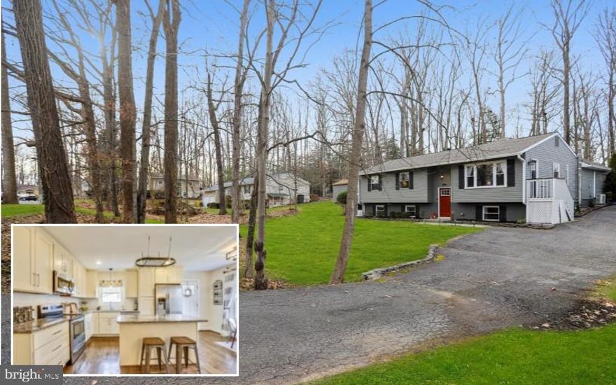 Big reduction on this beautiful 4 BR, 3 full BA  home in Rolling Knolls on over 1/3 acre offering its residents new award winning elementary school and just minutes to the Annapolis Mall, Downtown restaurants and just 20 min to BWI airport.  Features an amazing open floor plan and was completely renovated in 2016 with everything new  including doors & windows, Nest system, roof,  mechanicals, redesigned white, granite  and stainless Kitchen, new Baths, refinished hardwood floors, updated lighting, paint and carpet.   The supersize Family Room features skylights, booster electric heating and a/c for added comfort and slider to fenced yard with patio and  private wood setting.  Nicely appointed Master Suite and Bath.  Finished lower level with stunning wood stove, 4th Bedroom and full Bath and tiled bonus area with extra closet space and additional fridge.  This home has it all and is tucked away in this quiet quaint neighborhood.  Superb location! Kids playset included!