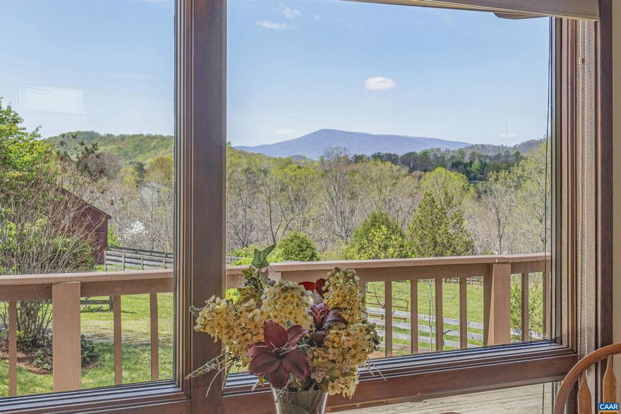 Welcome to Mimosa Farm, a stunning contemporary sitting on 11+ acres of pastoral and wooded privacy. Enjoy Blue Ridge Mountain views from every room on the main floor ? the sunsets are spectacular! Gorgeous hardwood floors and vaulted ceilings in the living/dining area. A soapstone wood stove sitting on a slate hearth creates a cozy atmosphere during cooler weather. With its built in book cases, the primary bedroom with ensuite bathroom can double as a home office; Firefly Fiber Internet makes telework a breeze. Another main level bedroom has sliding glass doors that open up to the expansive deck, which is also accessed from the living area. Downstairs, the finished walkout basement can easily function as an apartment. You have a great room, a wood stove, bedroom and bathroom, as well as a kitchenette with washer and dryer. Enjoy morning coffee and lovely pastoral views from the bluestone patio. A utility room with its own private entrance would be a great craft area or home gym. Have horses? There's a handsome 6-stall horse barn with 4-board fenced paddocks. The detached 2-car garage includes a storage/hobby room. Mimosa Farm is beautifully landscaped and ready for your summer cookouts.,Granite Counter,Wood Cabinets,Fireplace in Basement,Fireplace in Den,Fireplace in Living Room