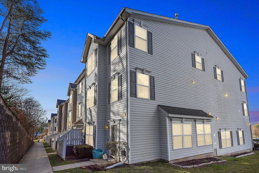 Welcome home to this bright and spacious townhouse that faces the tranquil woods in the back. Home has been painted throughout and updated! Step right in to the open concept main floor with family room right off the kitchen, allowing everyone to spend time together. Kitchen has stainless steel appliances new refrigerator (2021), gas stove (2020), built in microwave (2020), dishwasher (2020), plenty of cabinets and pantry. Family room with bay window is spacious and features a Smart thermostat. Everyone can gather here for relaxing, working, studying, or playing. Retreat to your own space on the upper levels. On the second level, two bedrooms have their own hallway bathroom and convenient access to the laundry room with washer and dryer. On the third level, the incredible primary bedroom suite covers the entire length of the home. Whether you need additional space for relaxing, watching TV, work area, office, this room has enough space for multiple functions. Here you have beautiful hardwood floors, ceiling fan, walk-in closet and additional closets space. A primary bathroom with double vanity and tub and shower combination completes the space. The common space includes the playground for enjoying the outdoors. Nearby is the Meade Village Park. This home is in great location, close to Ft. Meade, NSA, MARC Train to DC, and ten minutes from Arundel Mills Mall. You will love everything this home has to offer!