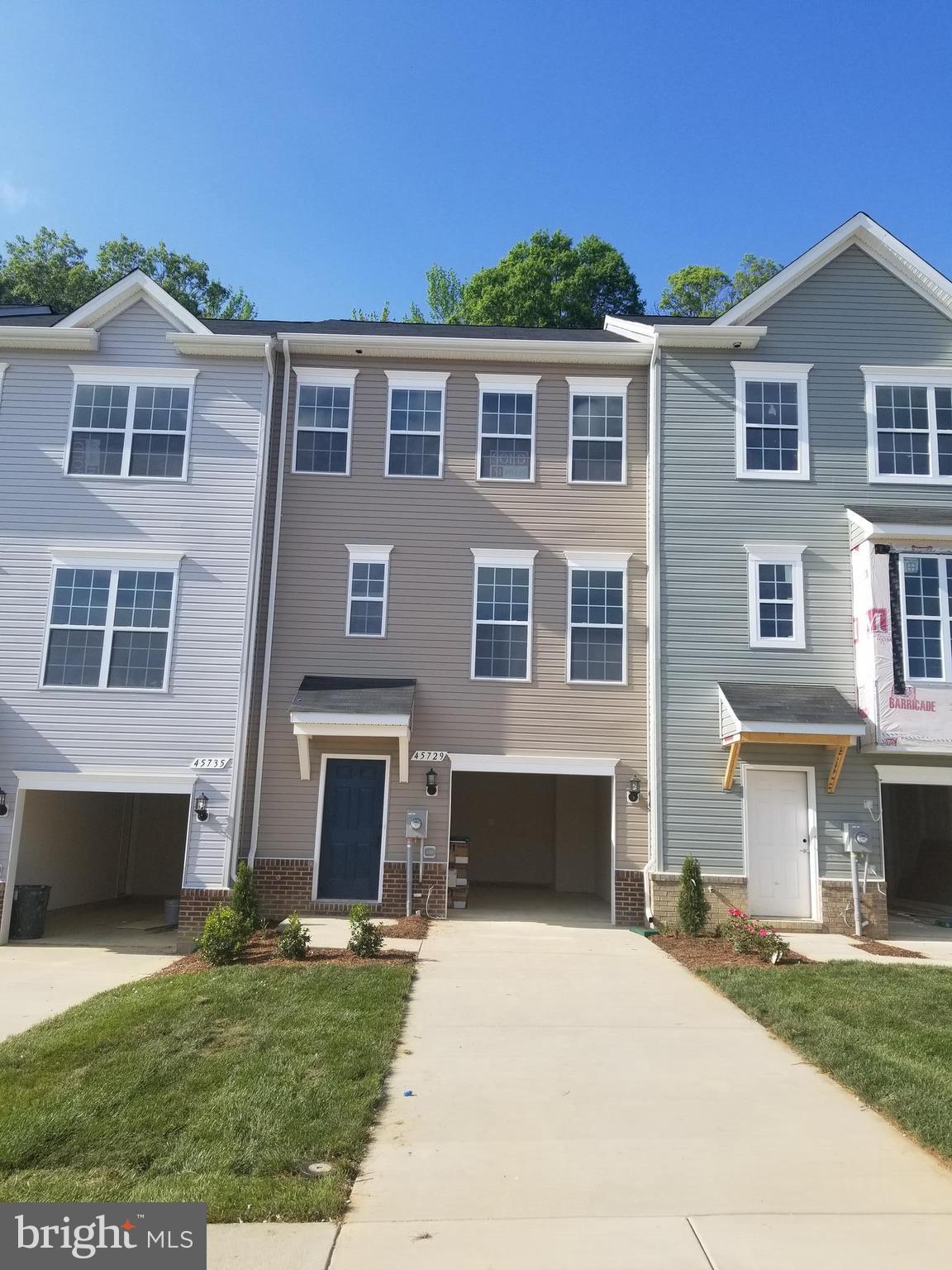 Sold & Settled Energy Star Garage Townhome at Elizabeth Hills on a site backing to woods. The Olympia #1 features a lower level garage w/ finished basement, hardwood stairs, rear kitchen design on the 1st floor (granite & upgraded cabinets) & 3 bedrooms and a laundry area on the upper level.