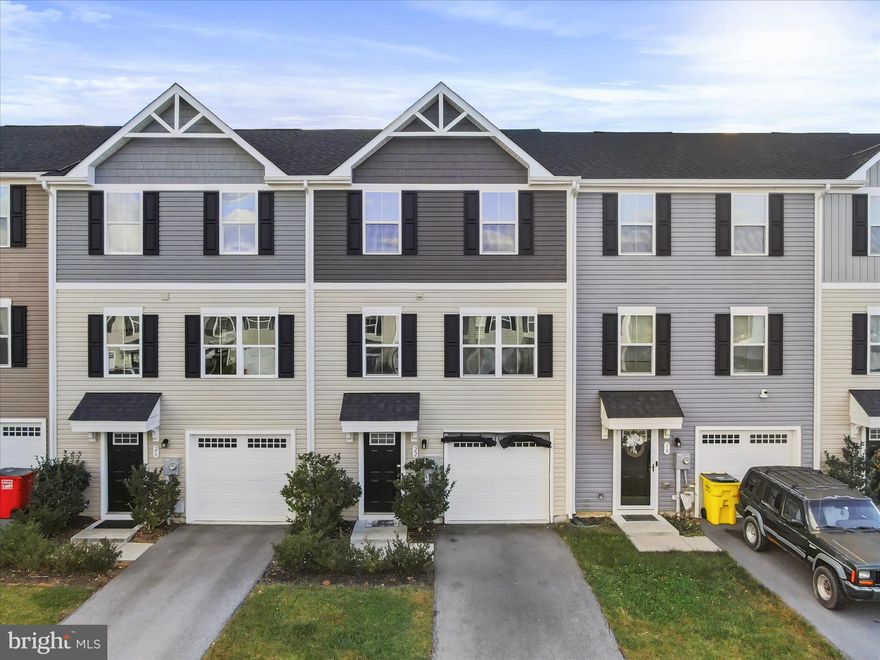 Home for the holidays! Welcome to this stunning smart townhome designed for modern living and everyday convenience. Featuring programmable thermostats and energy-efficient technology, this home combines comfort with innovation. The open, main level floor plan features a spacious living room, large kitchen with a huge island, and lots of cabinet and usable counter space. The primary suite offers a private bathroom and generous walk-in closet. The laundry is conveniently located on the bedroom level for easy access and efficiency. The versatile bonus room can serve as a fourth bedroom, family room, exercise, or game room. The lower level features a walkout to the backyard, providing great natural light and seamless indoor-outdoor living. There are so many amenities such as walking/jogging trails, a dog park, picnic pavilion, and children's playground/tot lot; there is something for all to enjoy. Ideal commuter location within just minutes to I-81 and the Maryland and Virginia state lines, only 45 minutes to Frederick and the MARC train. Don't wait months for new construction, this gorgeous only 5 year old home is available now, and move-in ready. Schedule your showing today!