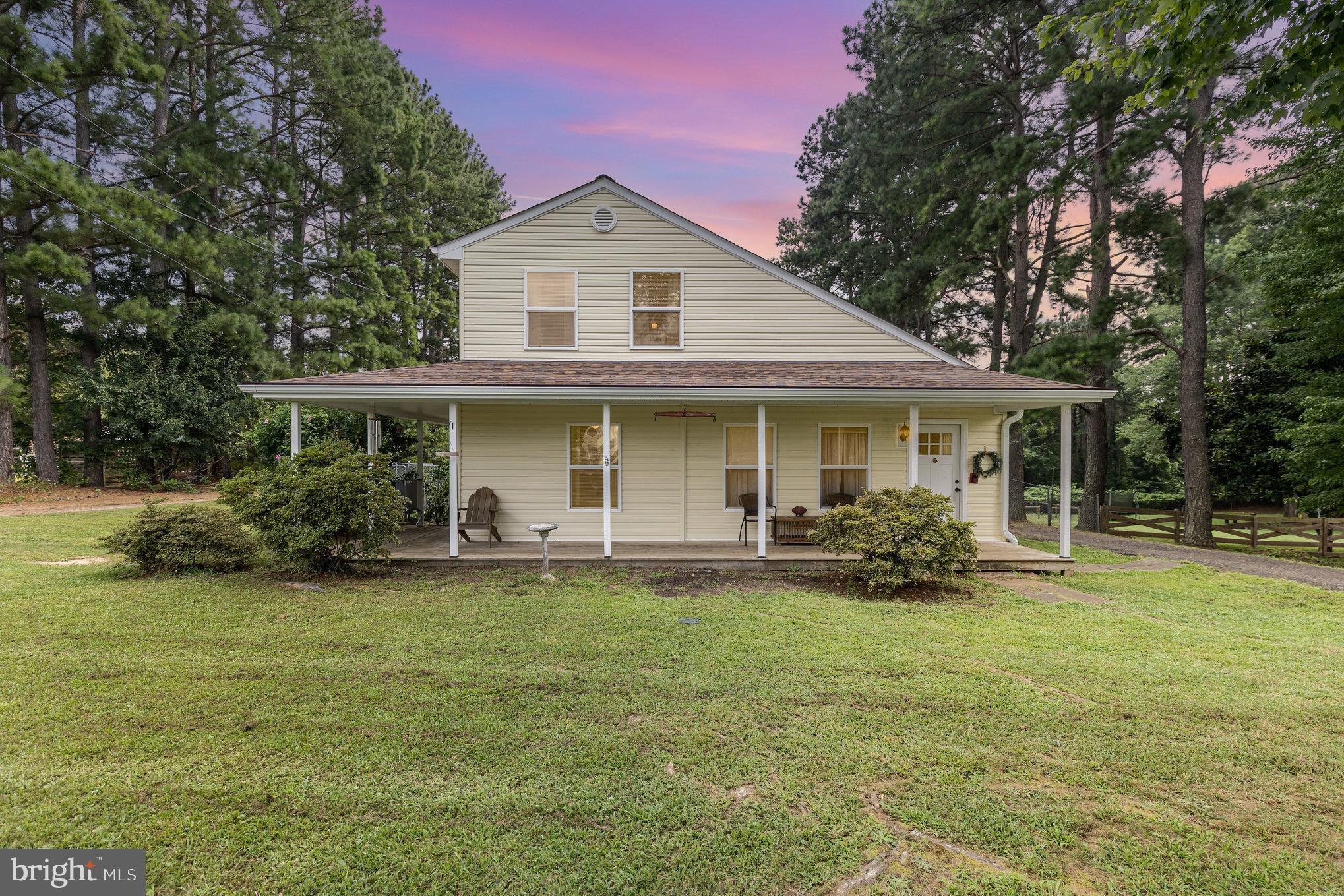This charming country farmhouse style Cape Cod home, nestled on a serene 0.52-acre lot, offers a perfect blend of comfort and charm. Step inside to discover a warm and inviting interior featuring built-ins and a traditional floor plan that seamlessly connects the family room to the country-style kitchen. The separate dining room sets the stage for memorable meals, while the entry-level bedroom provides convenience and flexibility. Stainless steel appliances, including a built-in microwave, dishwasher, and electric oven, elevate your culinary experience. Enjoy the ease of main-floor laundry with a washer and dryer included. Outside, the wrap-around front porch and rear deck invites you to unwind amidst the partly wooded backdrop, creating a peaceful retreat. A charming shed adds extra storage for your outdoor essentials. With its thoughtful design and tranquil surroundings, this home embodies an exclusive lifestyle of comfort and sophistication. Experience the perfect blend of nature and luxury in this delightful residence.