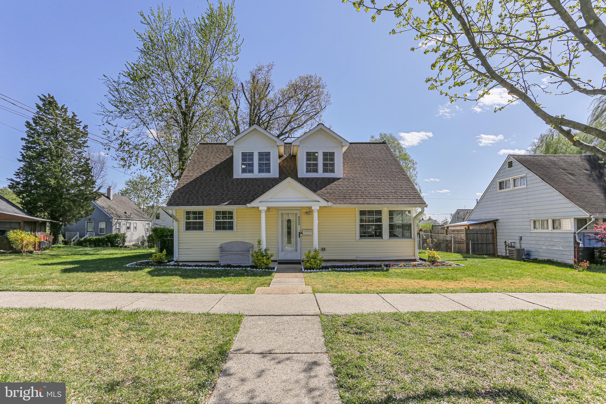 Welcome to 9939 Cottrell Terrace, a delightful home meticulously maintained, renovated throughout the years, and conveniently nestled inside the Capital Beltway in Silver Spring! This mid-century Cape Cod boasts a newer roof (2018) and windows and is the perfect blend of classic charm and modern potential, providing a comfortable living space across its well-designed layout. Upon entering, you're greeted by brand new luxury vinyl floors throughout the main level and a generous living room with a wood burning fireplace, accented by floor to ceiling brick that spans an entire wall, and serves as the heart of the home. The living room seamlessly flows into the renovated kitchen. The kitchen features 42-inch gleaming oak cabinets and upgraded with stainless steel appliances and a mosaic backsplash. It provides ample space for meal prep and storage with the addition of extra cabinets and counters along the entire wall of the former eat-in area. Beyond the kitchen is a spacious addition designed with an open, airy layout, tile floor, and large windows for an abundance of natural light and views of the rose garden and the lovely flat backyard. The main level includes two generously sized bedrooms. These bedrooms had the original small windows, now enlarged to enhance the space with natural light. Both bedrooms feature built-in storage. Adjacent to the bedrooms is a beautifully renovated full bathroom that adds a touch of sophistication. The space boasts a sleek walk-in shower with frameless sliding glass shower doors and stunning floor to ceiling marble with decorative accent. The upper level offers two additional bedrooms with laminate flooring and a full bath. No expense was spared as you enjoy enhanced space and natural light thanks to the addition of a charming dormer in the primary bedroom. This upgrade not only increased the square footage but also allowed for a large walk-in closet to be built between the two rooms for additional storage space. The beautifully upgraded bathroom offers classic white tiles, a large soaking tub and modern vanity with ample storage. Last but not least, step into the fully fenced backyard with a patio that exudes charm. The focal point of this beautifully landscaped space is a vibrant rose garden that has been lovingly maintained. In peak bloom it is bursting with color and fragrance. A stone retaining wall around a tree serves as a flowering bed. The custom-built shed offers storage space and a second patio. The front of the home features more garden beds and a semi-covered porch for bistro dining in the evenings. This home is truly turnkey ready with fresh whole house paint. Oakview residents have easy access to local schools, parks, shopping centers, public transportation, and major commuter routes. Lively Downtown Silver Spring is 10 minutes away. Anchored by Whole Foods, Regal Majestic Theater and with restaurants including Chido’s Tex-Mex Grill, Miss Toya’s Creole House, Copper Canyon Grill, and Matchbox, Downtown SS is in a class by itself. Shop until you drop with an eclectic mix of upscale retailers and local small businesses. The AFI Silver Theatre screens indie films and hosts festivals, and touring bands play the Fillmore. Guests enjoy year-round activities including outdoor live music, arts & craft fairs, and cultural festivals. In the winter, skate at the outdoor ice rink. The fun continues at Dave & Buster's and Big Escape Rooms. Downtown SS provides access to Metro Red Line for day trips to D.C. 9939 Cottrell offers the city outside your door without living in the city! Connect with nature at Brookside Gardens (20 min) and Sligo Creek Park with multiple trail access points nearby. Sports fanatics, head to College Park's XFINITY Center to cheer for the Terps! The University of Maryland has a strong basketball program competing at the NCAA Division I Level. This property presents a wonderful opportunity to own a classic home in a prime location. View the 360 Photo Tour!
