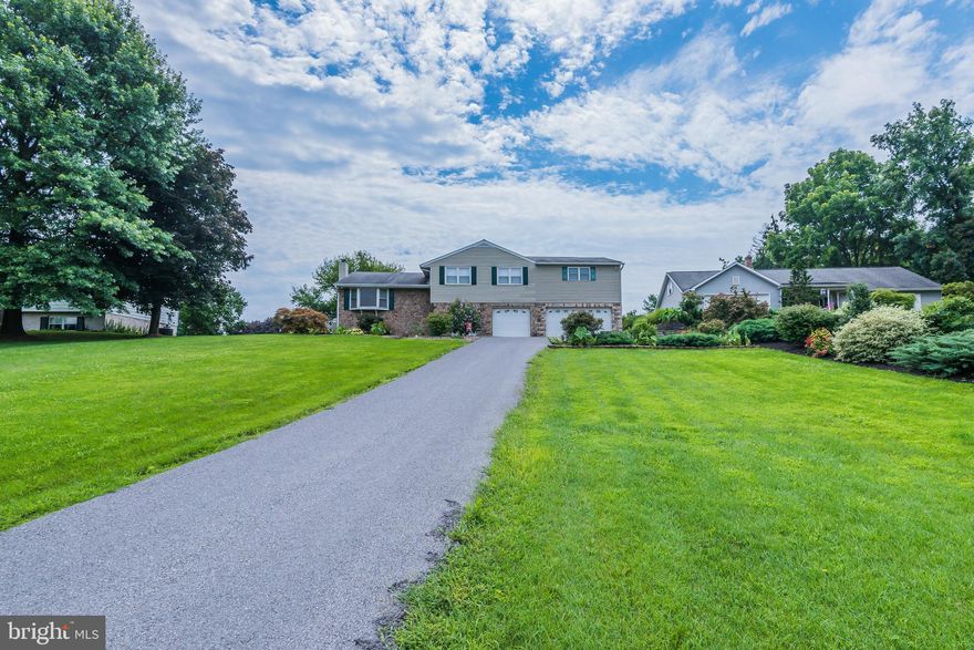 3-4 Bedroom, 3 full bathroom, split-level style home in a fantastic location! Quiet back road with beautiful mountianous views yet close to everything - I81, schools, shopping, medicals facilities and more! This home offers room for everyone! Large kitchen with new stainless steel appliances and dining area. Living room with hardwood floors and bay window to watch the sunrise over the mountains! Enjoy all four seasons in the Florida room overseeing the .57 acre lot. Gigantic master bedroom and separate bathroom with a jacuzzi tub and walk-in closet. 3 other bedrooms with large closets. Separate laundry room with a full bathroom. Fully finished basement with wood burning stove and more storage than you'll ever need! Live worry free with the back-up house generator and 3 heat sources! Central air for those hot summer days! The shed also conveys with the sale! GREENCASTLE SCHOOLS! 3-Car Garage and it's heated so it has unlimited possibilities. Everything you've been looking for, right here, in this house! Don't miss out - call today for your own private tour! This home also qualifies for 100% financing! Ask me how! FREE 1 YEAR HOME WARRANTY!