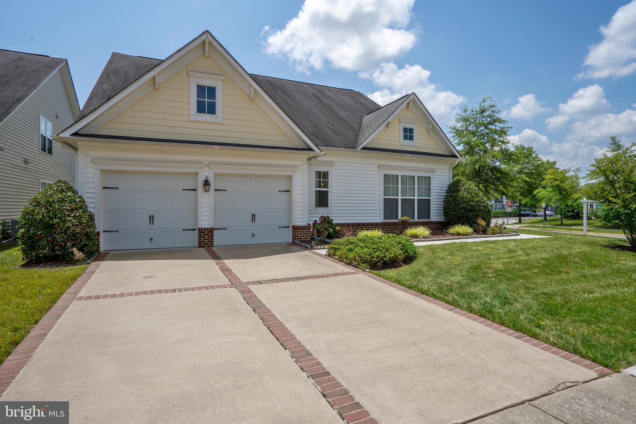 Active Adult Living at it's finest! Move in ready & spacious open concept villa style singe family Austen Model by Michael Harris Homes in an amenity rich community with community center offering a indoor & outdoor pools/hot tub/sauna/tennis courts/billiards room that is literally just steps out your front door. This fabulous 3 bed/3 bath home is filled with natural light, soaring vaulted ceilings and has gleaming wide plank maple hardwood floors throughout the entire first floor, staircase and entire loft area with bedrooms. The spacious owners suite offers dual walk in closets and an on-suite bath with shower and large soaking tub. The kitchen features a large island, gas cooking and flows into the living room with gas fireplace and vaulted ceilings. The yard is mowed by the community giving you plenty of time to enjoy the expansive patio, all you need to do is move in and relax! **Total finished SqFt is 2,700, tax records incorrect as is doesn't account for 2nd floor finished space. Additionally Seller To Install New Roof Prior To Settlement**
