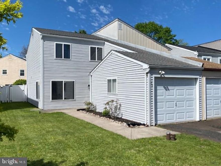Welcome to a truly charming contemporary two-story twin located at 64 Pennington Lane in Quakertown, this beautifully  home is filled with upgrades and thoughtful improvements that truly make it move-in ready. Recent improvements include a brand-new roof with full removal and replacement completed in August 2024, a renovated primary bathroom in March 2025, a newer HVAC system installed in 2018, and a new water heater. This bright and welcoming three-bedroom, two-and-a-half-bath home offers comfortable living with modern finishes throughout. Step into the foyer with a convenient coat closet and continue into the spacious living room, where large double windows flood the space with natural light. The first floor features all new flooring and fresh paint, creating a clean and inviting atmosphere. The dining room is enhanced with chair rail trim and a stylish rustic-modern chandelier, along with a sliding glass door that opens to a private, fenced rear yard. The recently renovated kitchen is a true highlight, featuring updated cabinetry, elegant Fantasy Brown dolomite countertops, stainless steel appliances, a subway tile backsplash, undermount lighting, recessed lighting and garbage disposal.  A large peninsula overlooks the dining area, making it perfect for both everyday living and entertaining. Additional main-level features include a generously sized laundry room with exterior access to the backyard and a convenient powder room. Upstairs, the primary bedroom suite offers a fully renovated modern bathroom with an oversized vanity and a linen closet. Two additional bedrooms and another full bathroom complete the second floor, providing flexible space for family, guests, or a home office. Outdoor living is equally appealing, with a rear patio, a well-maintained lawn, and a fully fenced vinyl privacy yard that creates a peaceful setting for relaxing or entertaining. A one-car garage adds both convenience and additional storage. The home is serviced by public water and sewer and benefits from no HOA fees and low property taxes. Conveniently located near Route 309, the Pennsylvania Turnpike interchange, and a variety of shopping and dining options, this home offers both accessibility and everyday ease.