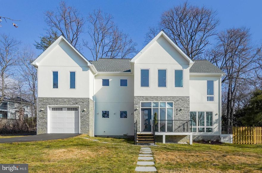 Welcome to this stunning transitional contemporary home, completely reimagined from the foundation up and completed in 2025 with the finest craftsmanship and attention to detail. Nestled in the heart Town of Vienna, this architectural masterpiece seamlessly blends modern sophistication with European-inspired design, offering a luxurious yet functional living experience. ****************************************************************************************************************** 
 Step inside to an inviting, light-filled entryway that sets the tone for this exceptionally designed residence. The open-concept floor plan is thoughtfully curated to maximize natural light, comfort, and versatility, making it perfect for today’s lifestyle. Designed with top-tier European finishes, this home features GROHE plumbing fixtures, Iris Italian tile, and premium craftsmanship throughout. A dedicated main-level bedroom/office and a spacious open concept floor plan provide flexibility for work, guests, or entertainment. ****************************************************************************************************************** 
 At the heart of the home, the chef’s kitchen showcases sleek German-engineered Hacker cabinetry, premium Bosch stainless steel appliances, Calcutta Gold quartz countertops, and an elegant tile backsplash—a perfect blend of form and function. Wide-plank blonde engineered hardwood floors add warmth and sophistication throughout the main and upper levels. ***************************************************************************************************************** 
 Upstairs, the industrial staircase with modern accent lighting leads to four generously sized en-suite bedrooms, each designed for comfort and style. The luxurious primary suite features spa-like finishes, ensuring a serene retreat. The conveniently located upper-level laundry room is equipped with a brand-new Samsung front-loading washer and dryer. ****************************************************************************************************************** 
 Step outside to your expansive private backyard, offering endless possibilities to create your dream outdoor oasis. Whether you envision a cozy firepit with string lights, a play area for kids, or an entertainer’s paradise, this space provides plenty of room for relaxation and fun—all within the brand-new privacy fence for added seclusion and tranquility. ****************************************************************************************************************** 
 The attached one-car garage is designed to meet your electric vehicle charging needs, ensuring convenience for modern living. It seamlessly connects to a well-appointed mudroom, creating a practical drop-off zone for groceries, sports gear, and everyday essentials—keeping the rest of your home organized and clutter-free. ****************************************************************************************************************** 
 Beyond the home, you'll enjoy a stellar location, just minutes from Vienna and Dunn Loring Metro stations, with effortless access to I-66 and I-495, making commuting a breeze. Enjoy premier shopping and dining options in the Town of Vienna, Tysons Corner, and Mosaic District, all just a short drive away. ****************************************************************************************************************** 
 Built to last with high-end materials and impeccable attention to detail, this home is truly move-in ready—offering an unparalleled living experience in one of Vienna’s most sought-after locations.