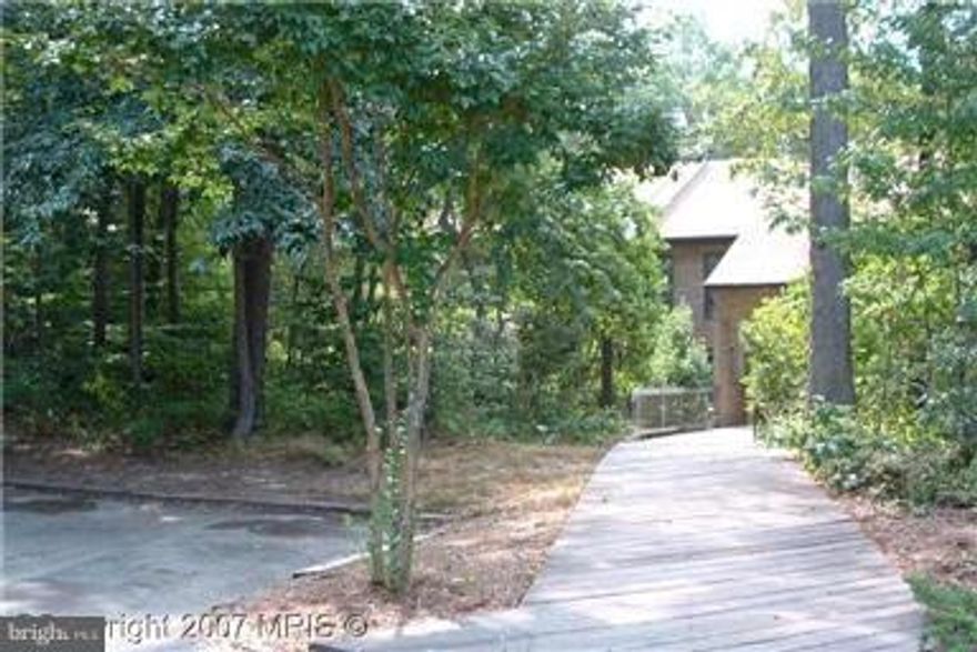 Mid-level condo facing woods. No stairs, just walk right to your front door. Great location, close to shopping, dining, Pax River, schools and more. Unit # is 1043