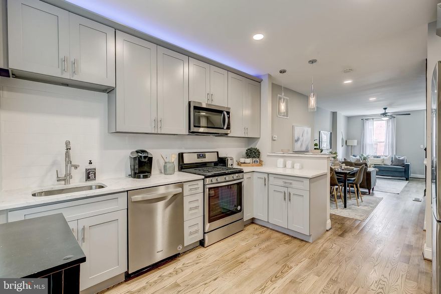 Located one block away from Patterson Park, this three bedroom with two bathroom townhome has it all! Barn doors, modern fixtures and vanities, rich refinished hard wood floors, and stainless steal appliances offer the buyer a taste of modern contemporary style. The basement is fully finished and there is a space for parking in the rear of the home.