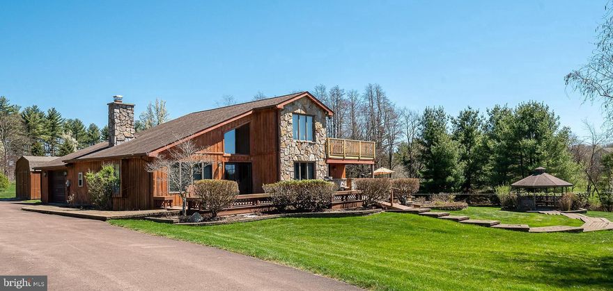 New price + new composite deck renovation! 3BR, 2.5BA lake view home WITH dock slip in the coveted Glenfield community! Possible to expand to 4/5 bedrooms with simple changes. Very few communities at Deep Creek Lake offer paved roads & expansive dock area parking lot - and fewer still have bathrooms, level access, a park-like peninsula & diverse common area. Glenfield is simply one of the most desirable lake access areas you will find and this home is only a few hundred feet away. Enjoy one-level living with water views from multiple parts of the house & property. Inside, you will love the gourmet kitchen renovations, dual dishwashers, large pantry and even a gas fireplace. Lake views from the dining room table are a bonus! Large first level master suite with sitting area, soaking tub, his/her vanities, custom tile shower and laundry room. Other features include floor to ceiling wood-burning fireplace, hardwood floors, mud room & attached garage. Outside, enjoy extensive hardscaping, private gazebo, storage building and huge grassy yard with all day sun. Conveys mostly furnished. Established vacation rental, Sunset Serenity.