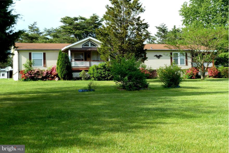 Large model doublewide in country setting to please & entice. 3 covered porches/decks(Front14x10;Rear8x8;Side 26x10) to enjoy the pastoral setting. Detached carport & sheds for plenty of storage & parking. Spacious rooms, and family room with cozy fireplace to enjoy. Peace & quiet await the savvy buyer. All on 1 acre with flowering bushes, close to VA line, easy commutes on I81.