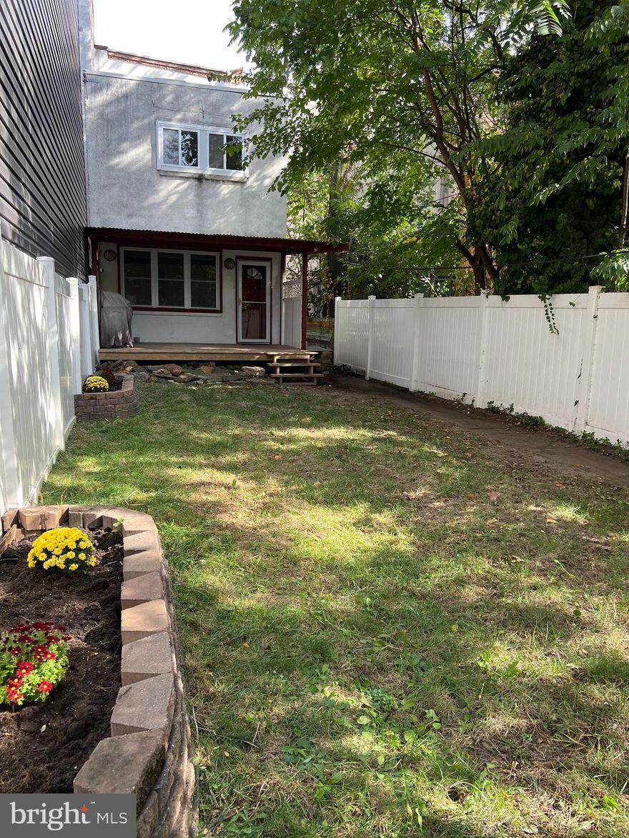 1320 Broad Street Unit H is a very special one bedroom, one bath condominium ownership opporturnity. Unit H is rear-set and thus located at the back of the building's front elevation on Broad Street. Thus, it has a rare, private fenced garden and one deeded off-street parking space. Park at 1319 S. Carlisle Street, and walk through the gate into the garden and up path to the large, new covered deck and main entrance. One cannot hear the Broad Street rush here, and there is no other unit above the bedroom here, so there is no noise from an upstairs neighbor in your bedroom. The unit has a large sunny living room / dining area with new windows that open back out to the deck. It has an updated modern, efficient kitchen with a gas range and good storage, along with a breakfast bar opening back into the living space, which is bright and has a private view of the garden. Stairs up to the upper level to a bedroom and bathroom suite. Bedroom has pretty windows and hardwood floors, ample double closets and a remodeled luxe full bath. There is a washer/dryer hook up plumbed into a laundry closet for private laundry. The covered deck itself acts an an additional outside 'room' for 8-9 months of the year, with space for a grill, bikes, patio furniture and is great for pets!  This Unit does have access to the main building lobby and front entrance. The building does offer a shared laundry room and a dedicated storage locker, along with a mechanicals workroom for heating and cooling equipment.