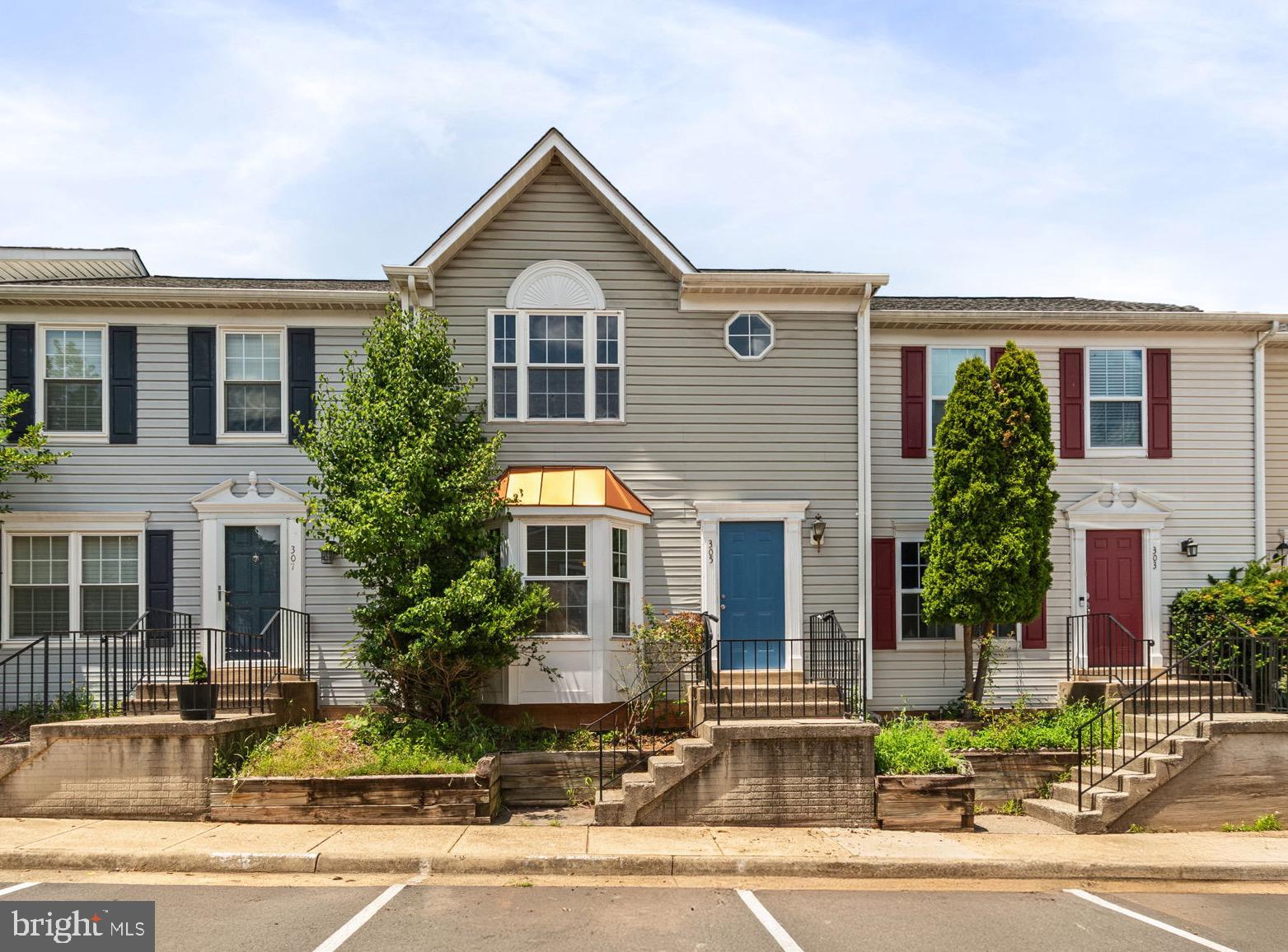 Welcome to this beautifully updated 3-level townhome featuring 3 bedrooms, 3.5 baths, and a fully finished walkout basement. Recent upgrades include newer flooring, fresh paint, updated kitchen appliances, and a renovated hall bath. The main level offers open living and dining areas with LVP flooring and access to a spacious deck—perfect for entertaining. Upstairs includes 3 bedrooms and 2 full baths, while the lower level adds a full bath, laundry/utility room, and rear entry—ideal for guests or a home office. Enjoy two assigned parking spaces, ample visitor parking, and a fenced yard with a patio. Condo fee covers water, sewer, trash, master insurance, and more! - Please note: select photos have been virtually staged to help visualize the property's potential.